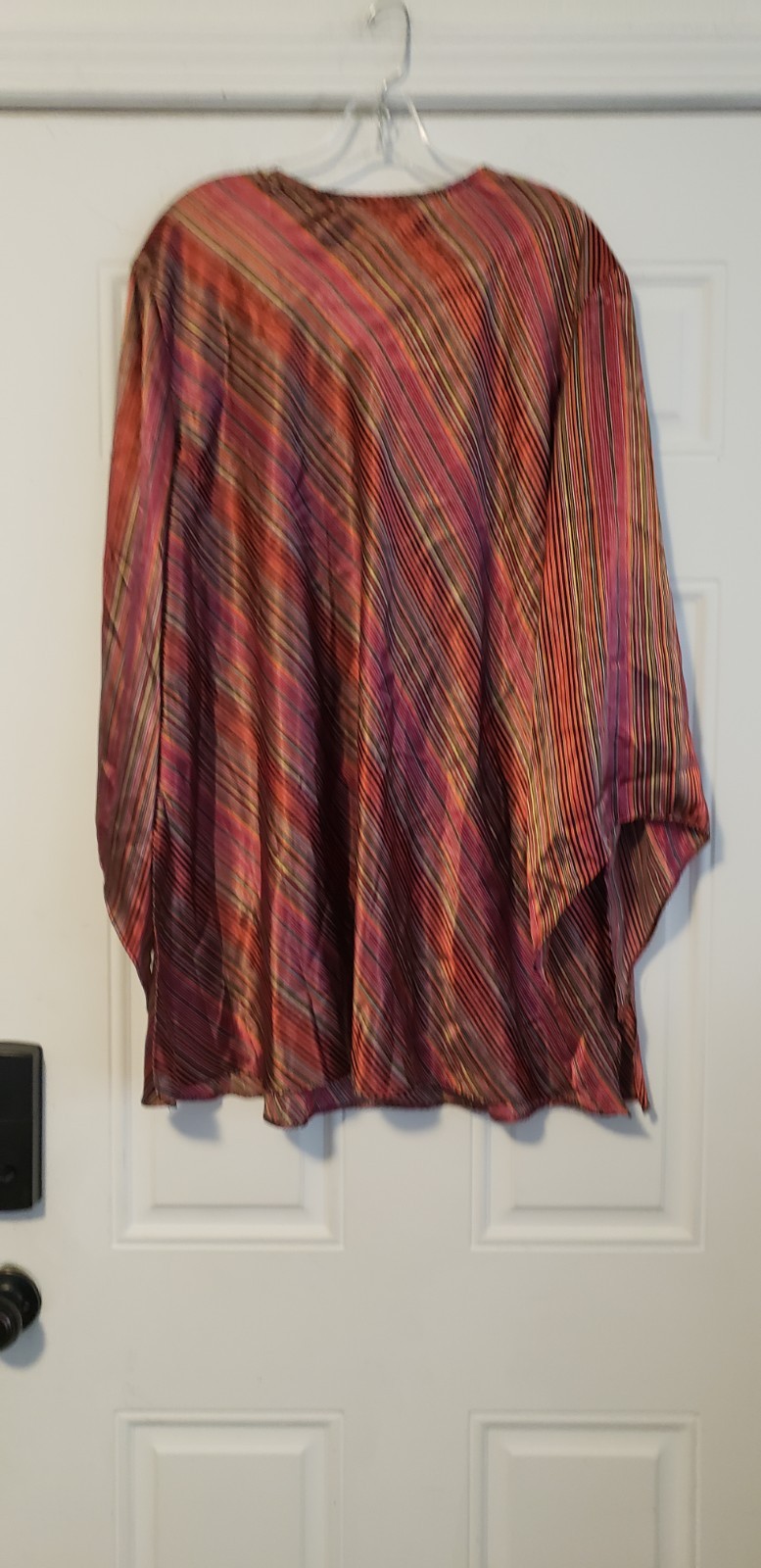 vintage Lane Bryant plus-size satin-look blouse, recognizable by its plunging…