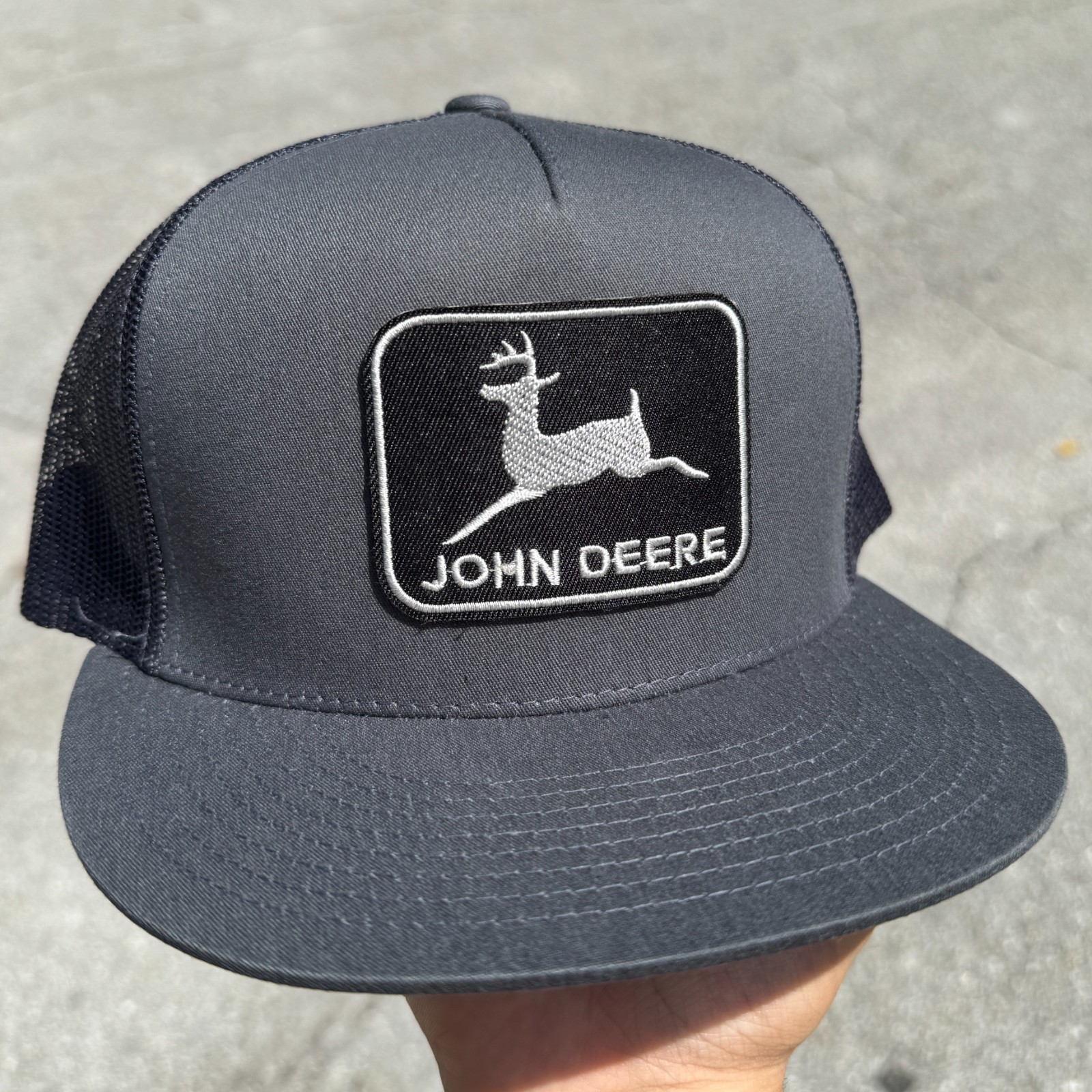 John Deere Black Patch on Yupoong Trucker Hat / YP Classic 6006 Snapback Cap