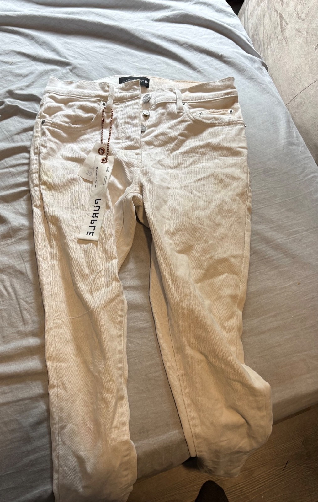 purple jeans size 26 color white ,worn a few times brand purple not fake skinny