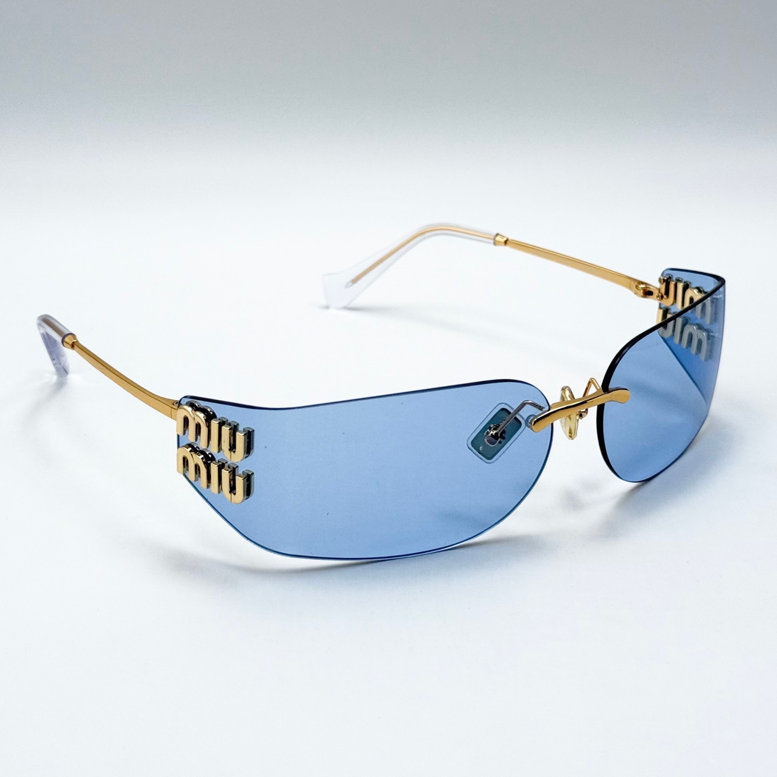 Miu Miu SMUA51 Wrap Sunglasses Pale Gold Frame Blue Lens Women 75-14-110