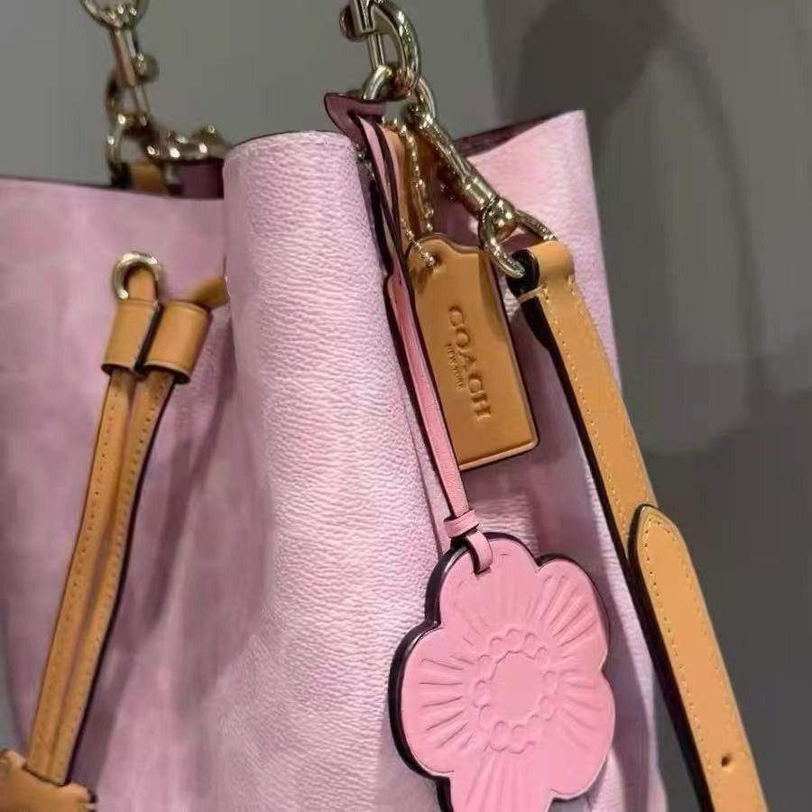 Coach CEA23 Rowan Bucket Bag In Signature Canvas With Charms Powder Pink