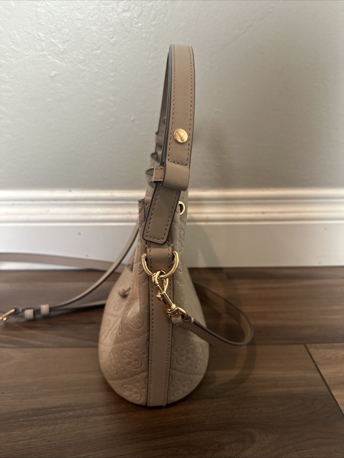 Tory Burch T Monogram debossed leather bucket bag in a “Fresh Clay”