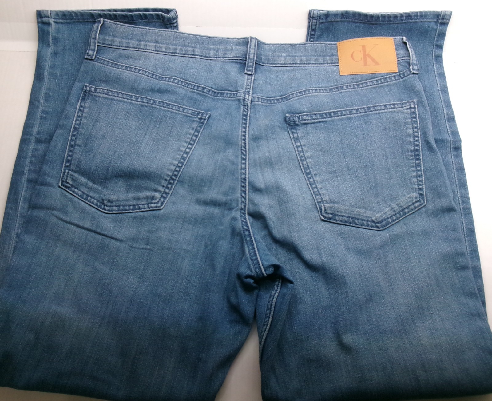 Calvin Klein Straight Leg Jeans sits below waist easy fit hip &thigh Medium Wash
