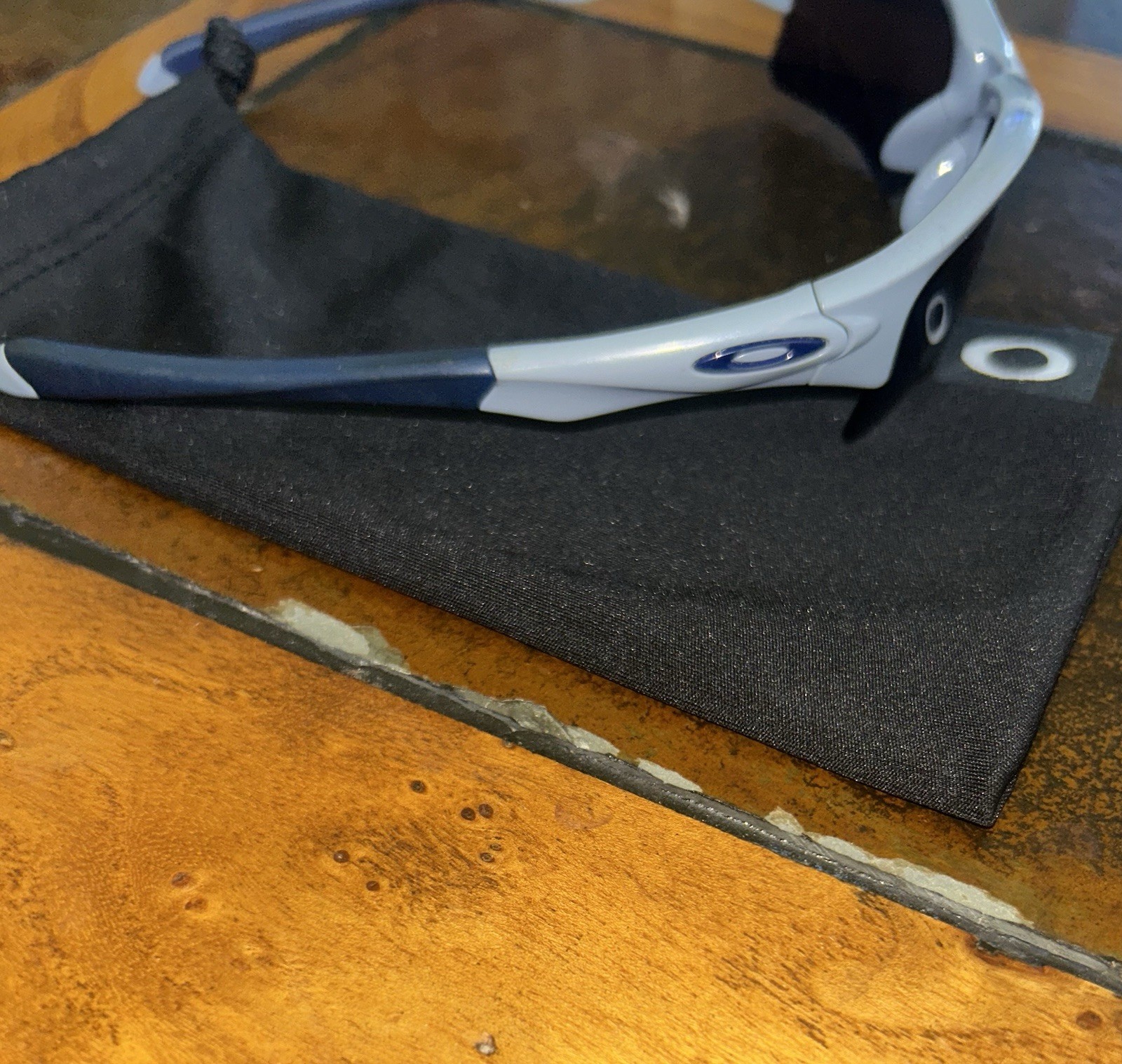 Oakley quarter jacket, gray frame, navy ear, socks and nose pads, black lenses