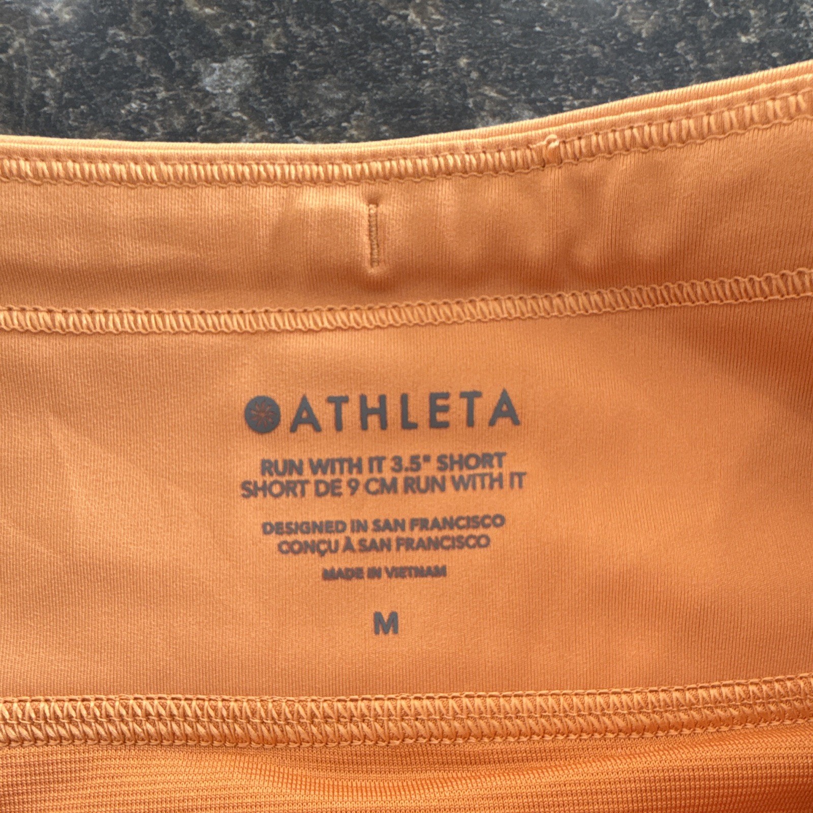 Athleta Women’s Run With It Orange 3.5in Running Shorts Drawstring Pockets