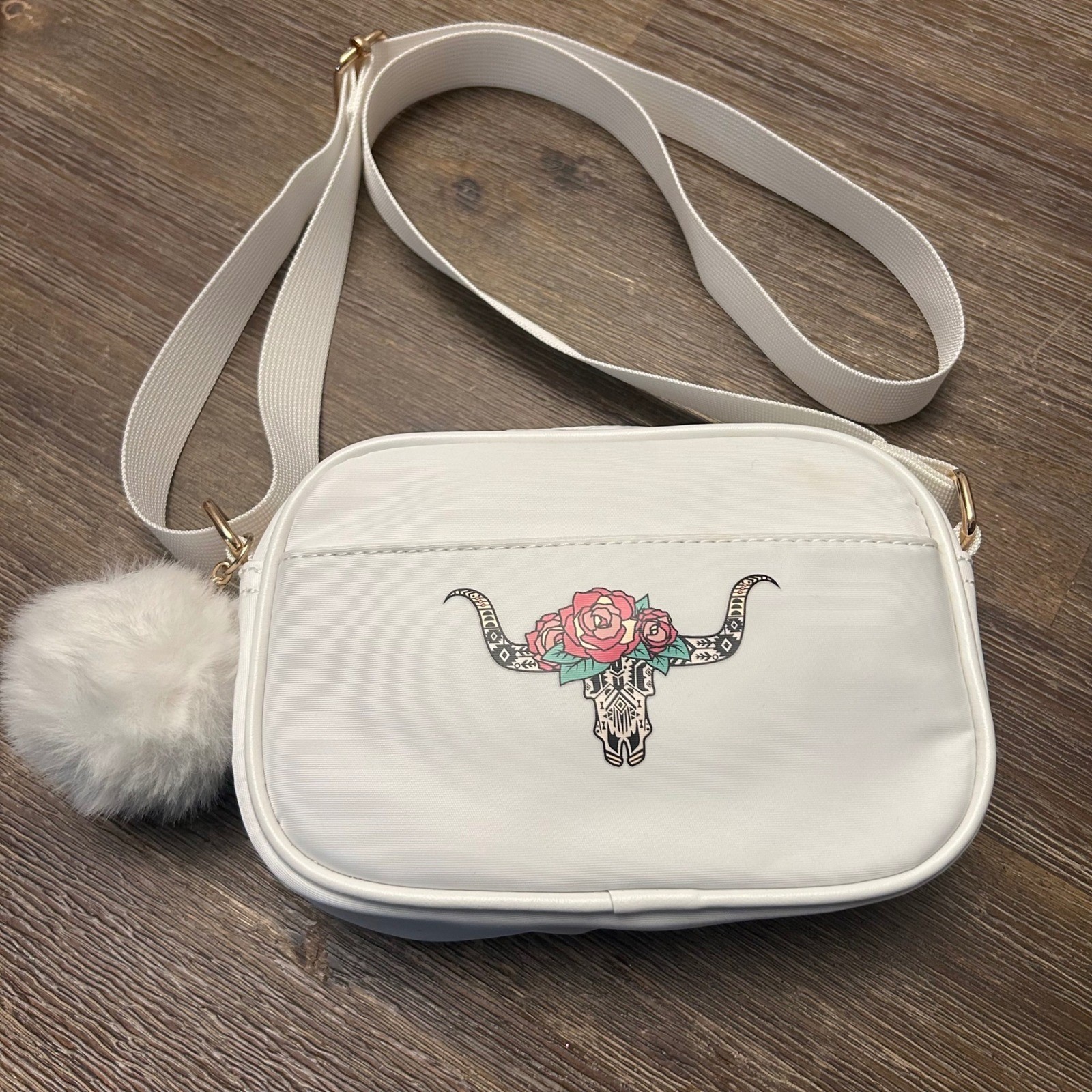 Like Dreams White Crossbody Bag with Bull Skull Floral Design and Pom Pom