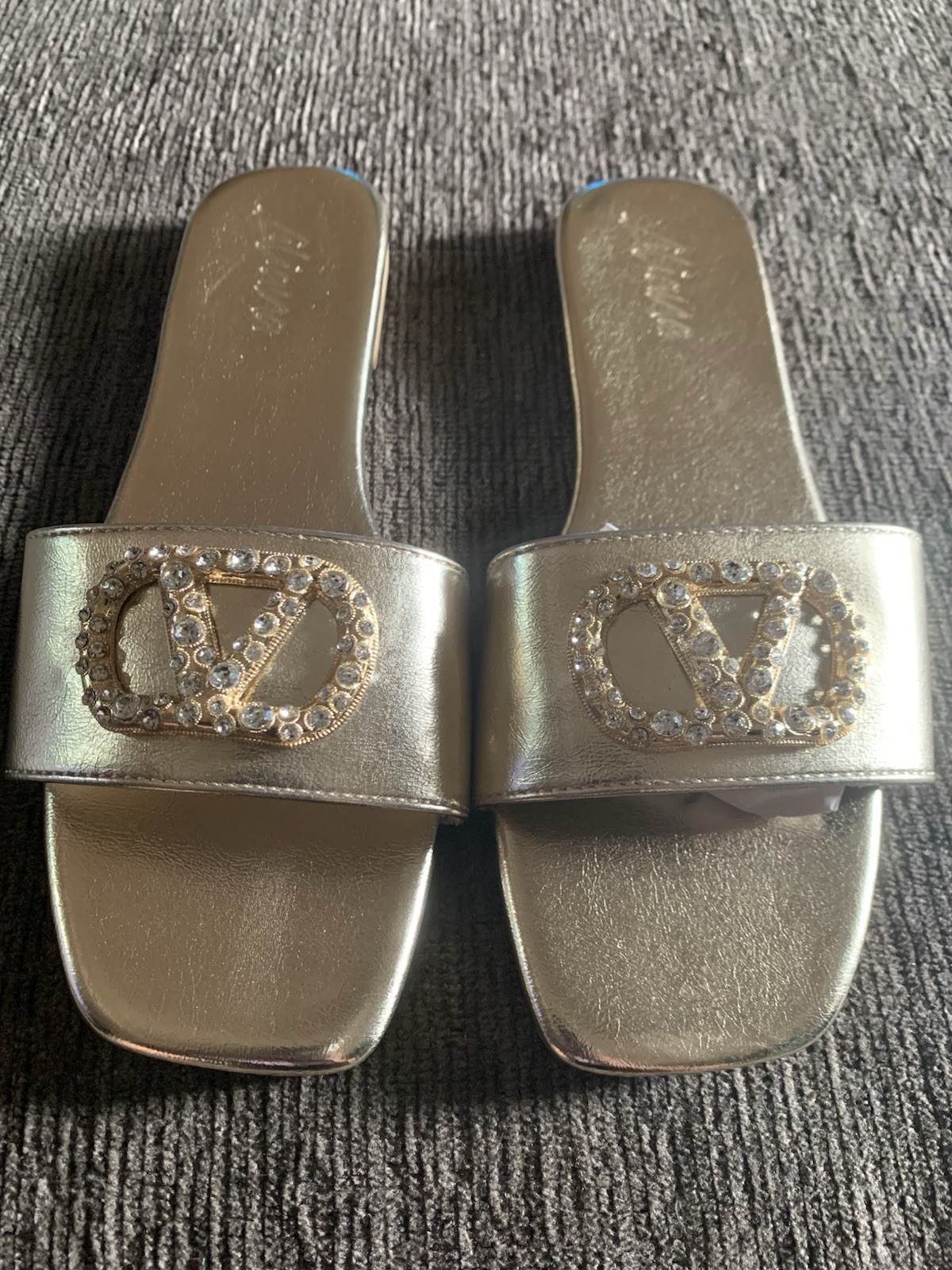 Liliana Rhinestone logo slide in gold.