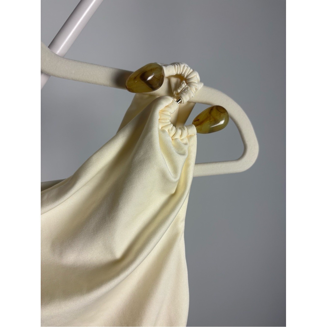 Peppermayo Pale Yellow Draped Mini Dress with one shoulder embellishment