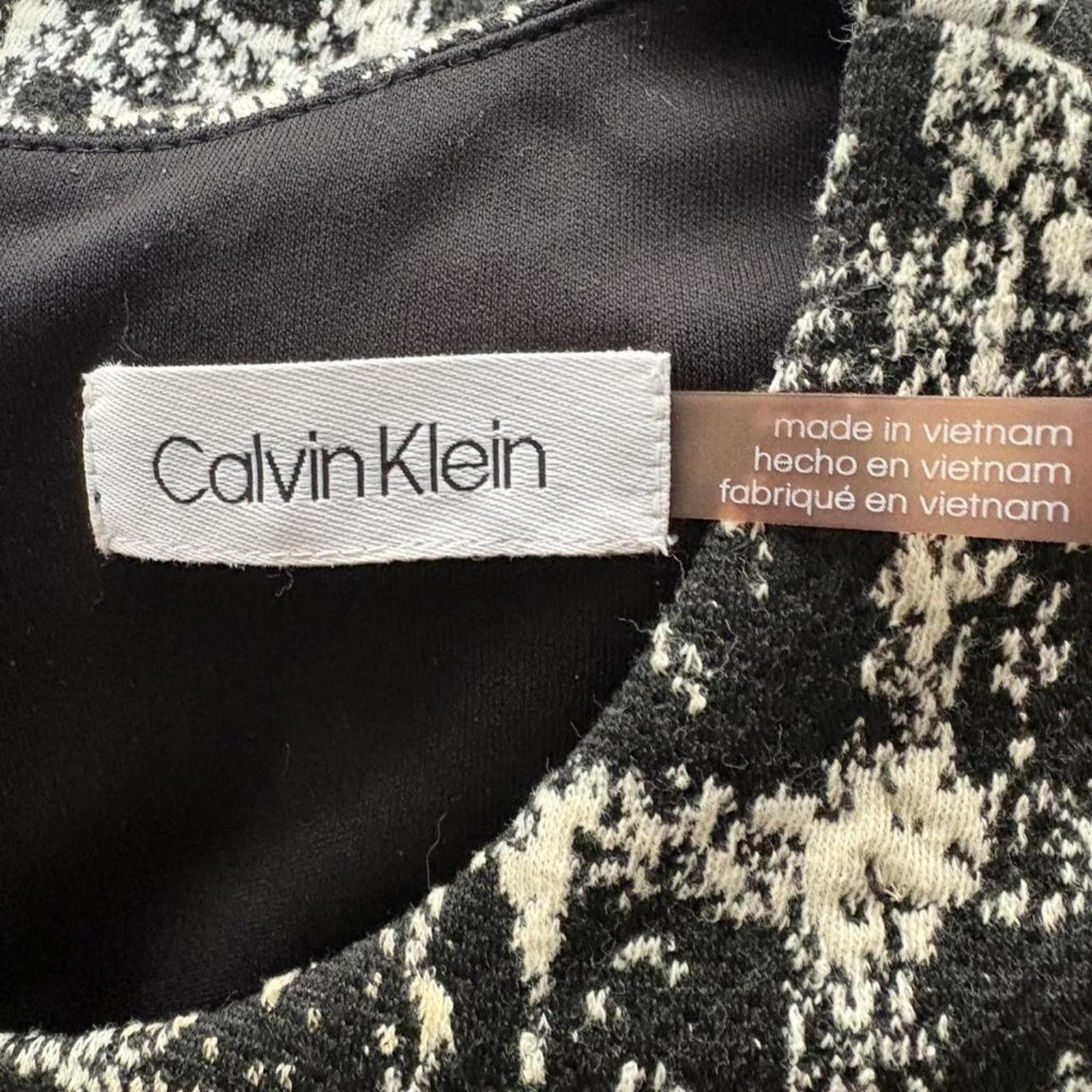 Calvin Klein form fitting dress, stretchy fabric lined size small
