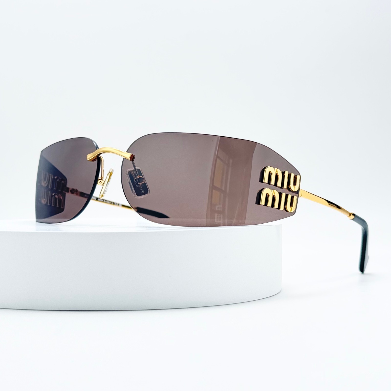 Miu Miu SMUA51S Rimless Oval Sunglasses Gold Frame Brown Lens Women 75-14-110