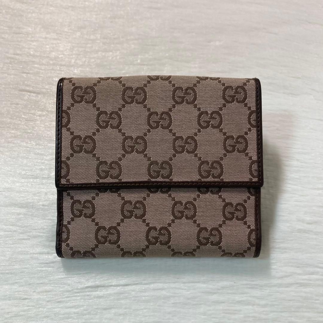 Popular item excellent condition GUCCI two fold canvas flap hook brown