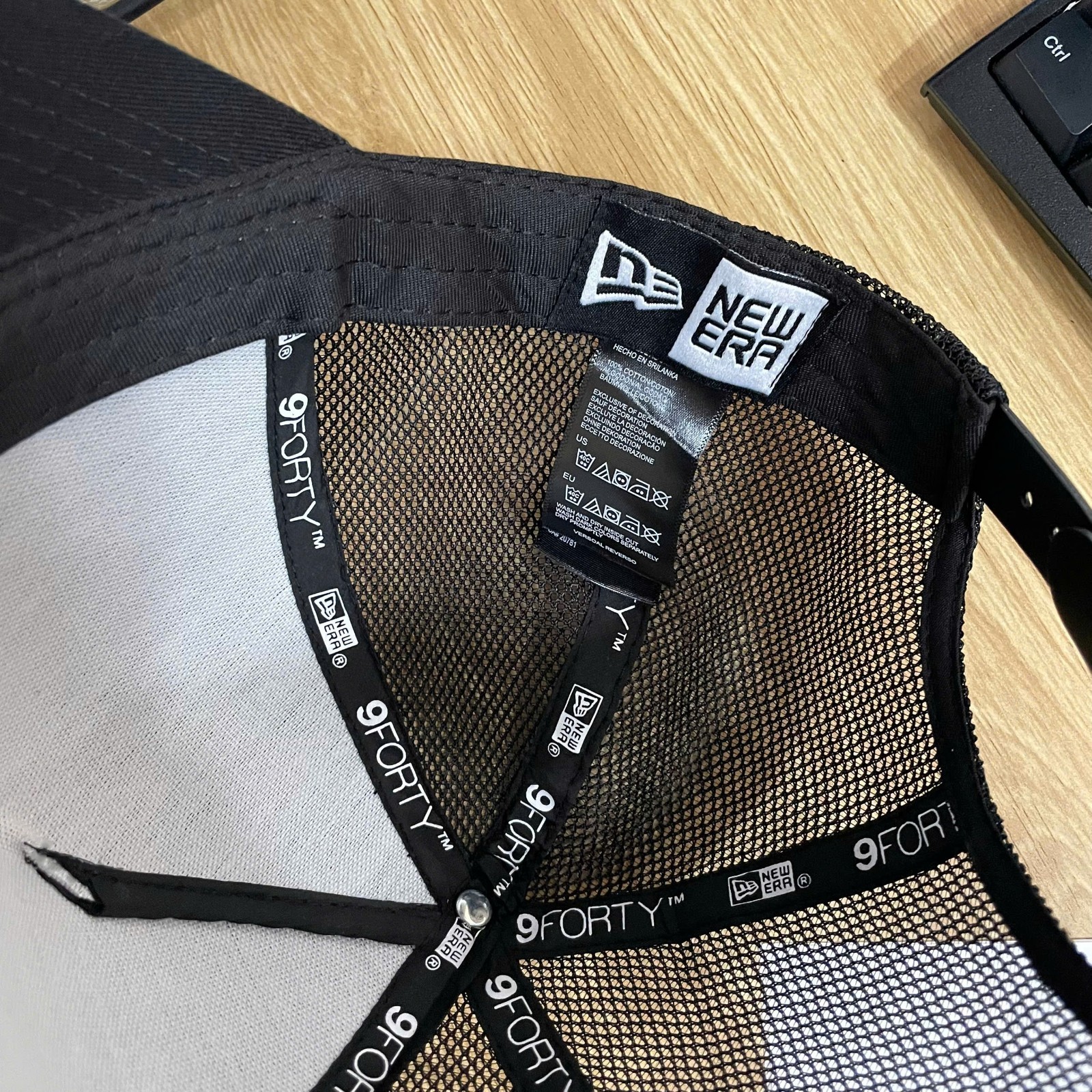 Four Seasons Hotel Embroidered 9FORTY Trucker Hat Black Mesh Snapback Cap