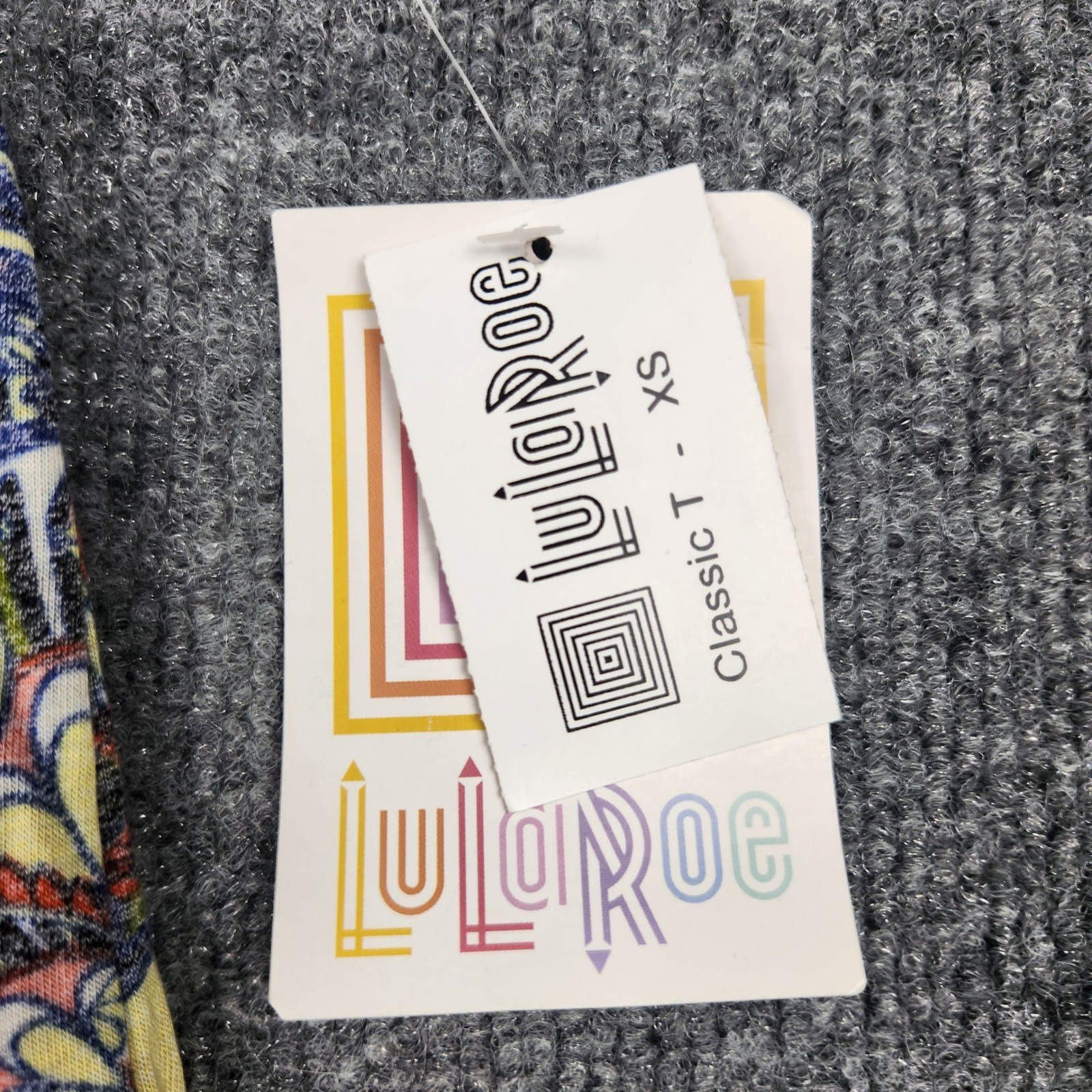 LuLaRoe Classic T Womens XS Blue Yellow Floral Geometric Patchwork High Low Top