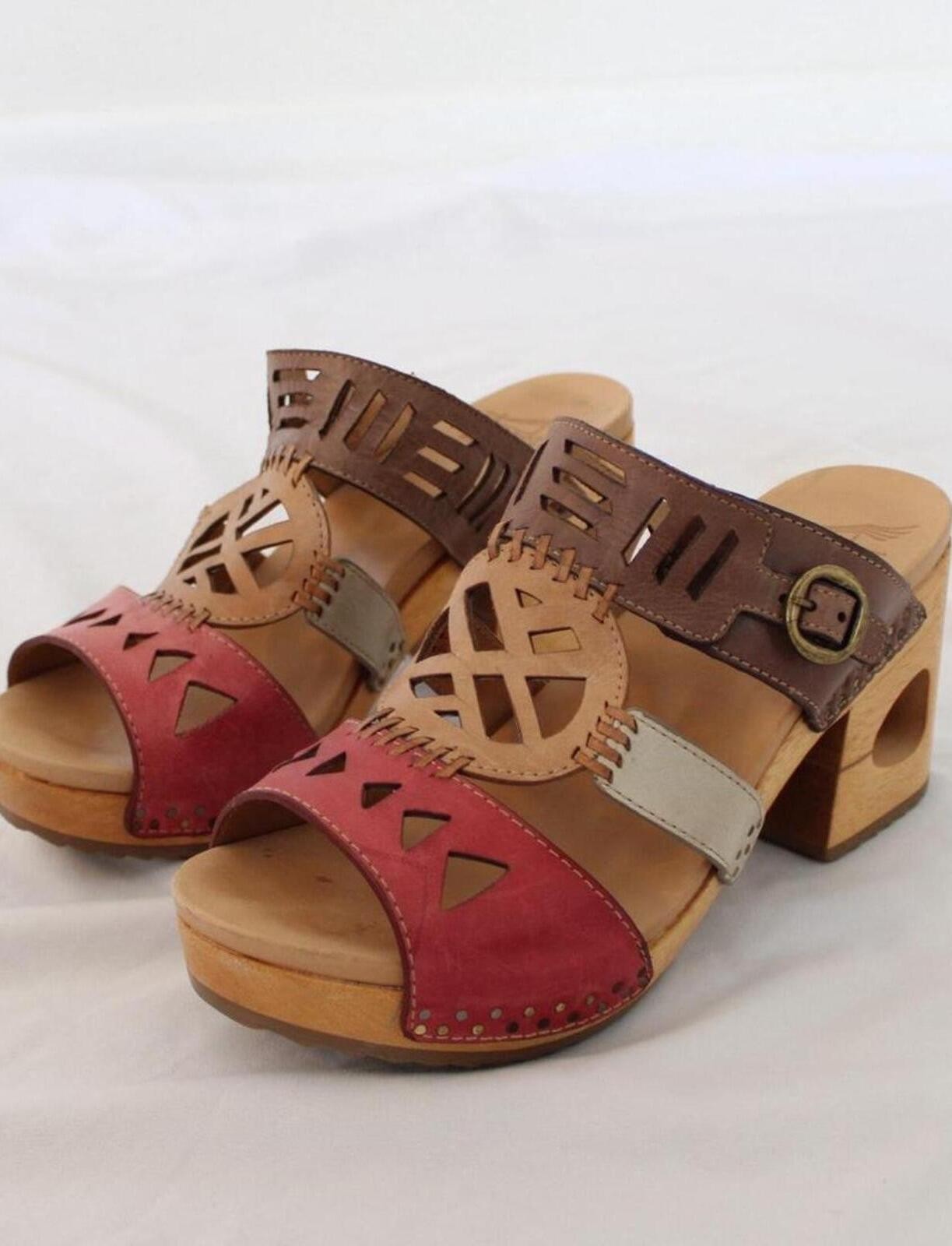 Dansko Oralee clogs with a leather upper with cut-out designs. size US 7.5-8
