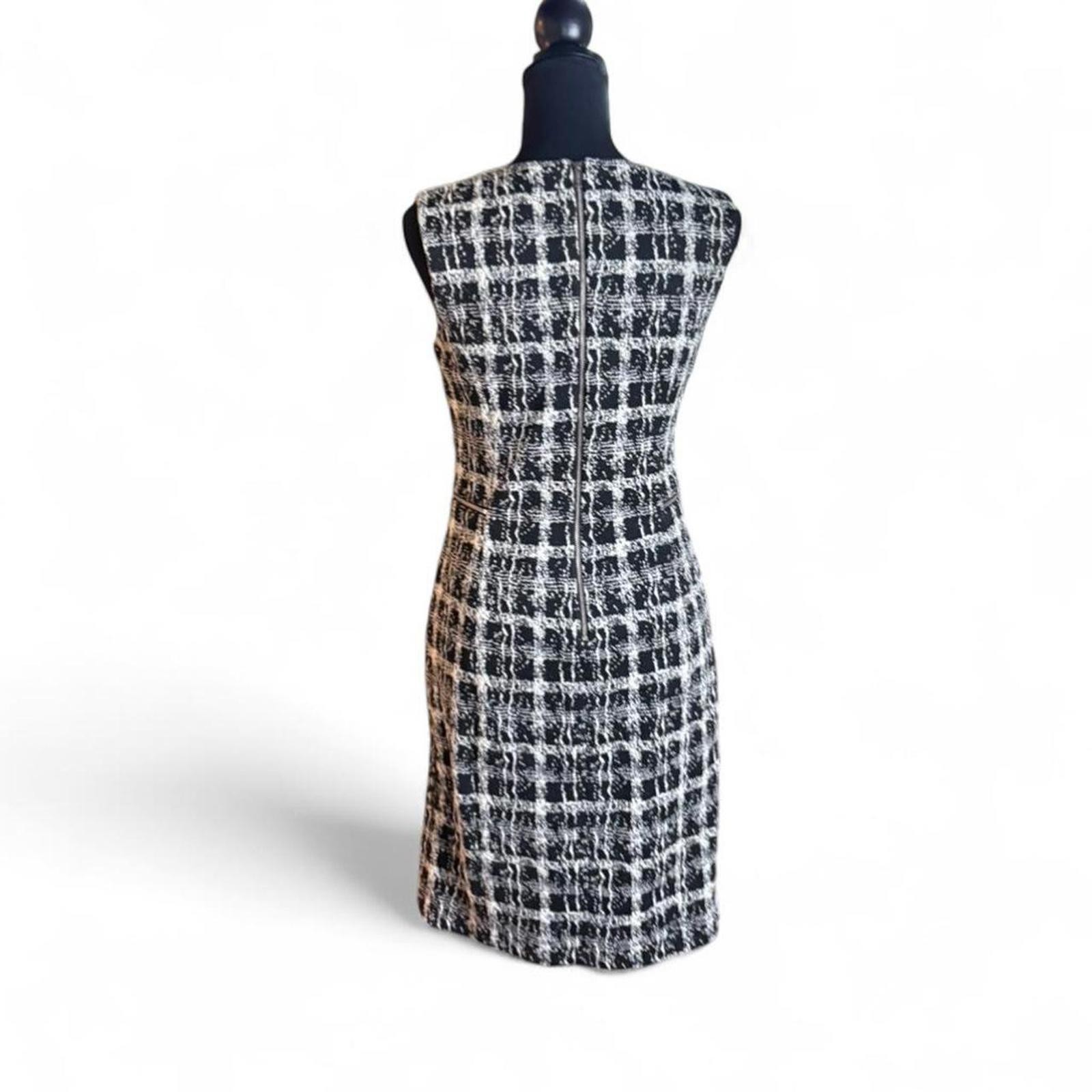 Calvin Klein form fitting dress, stretchy fabric lined size small