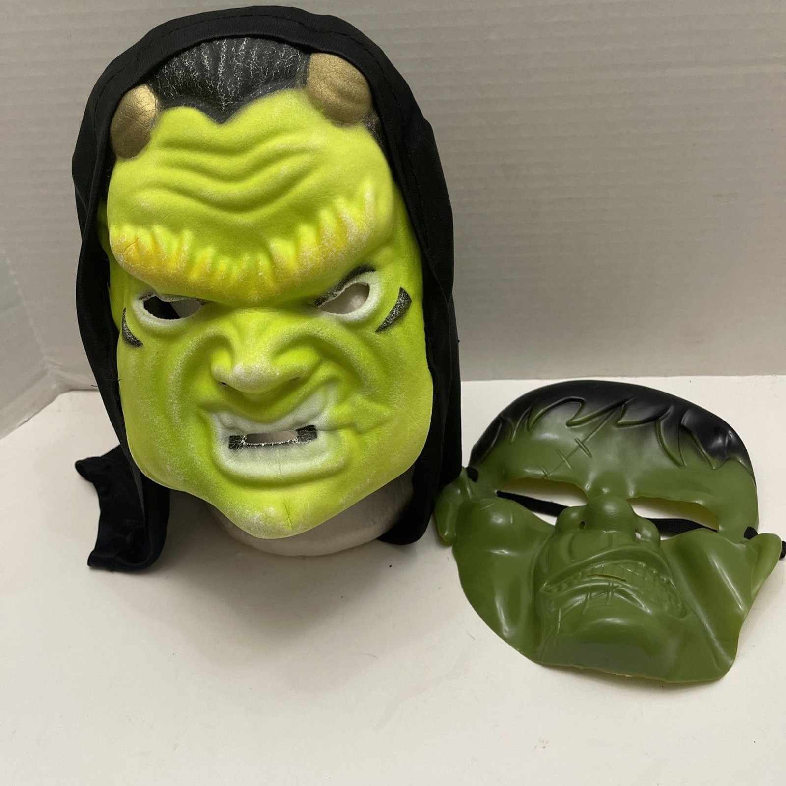 Two Halloween Masks Frankensteins Monster And Hooded Orc Elastic Band