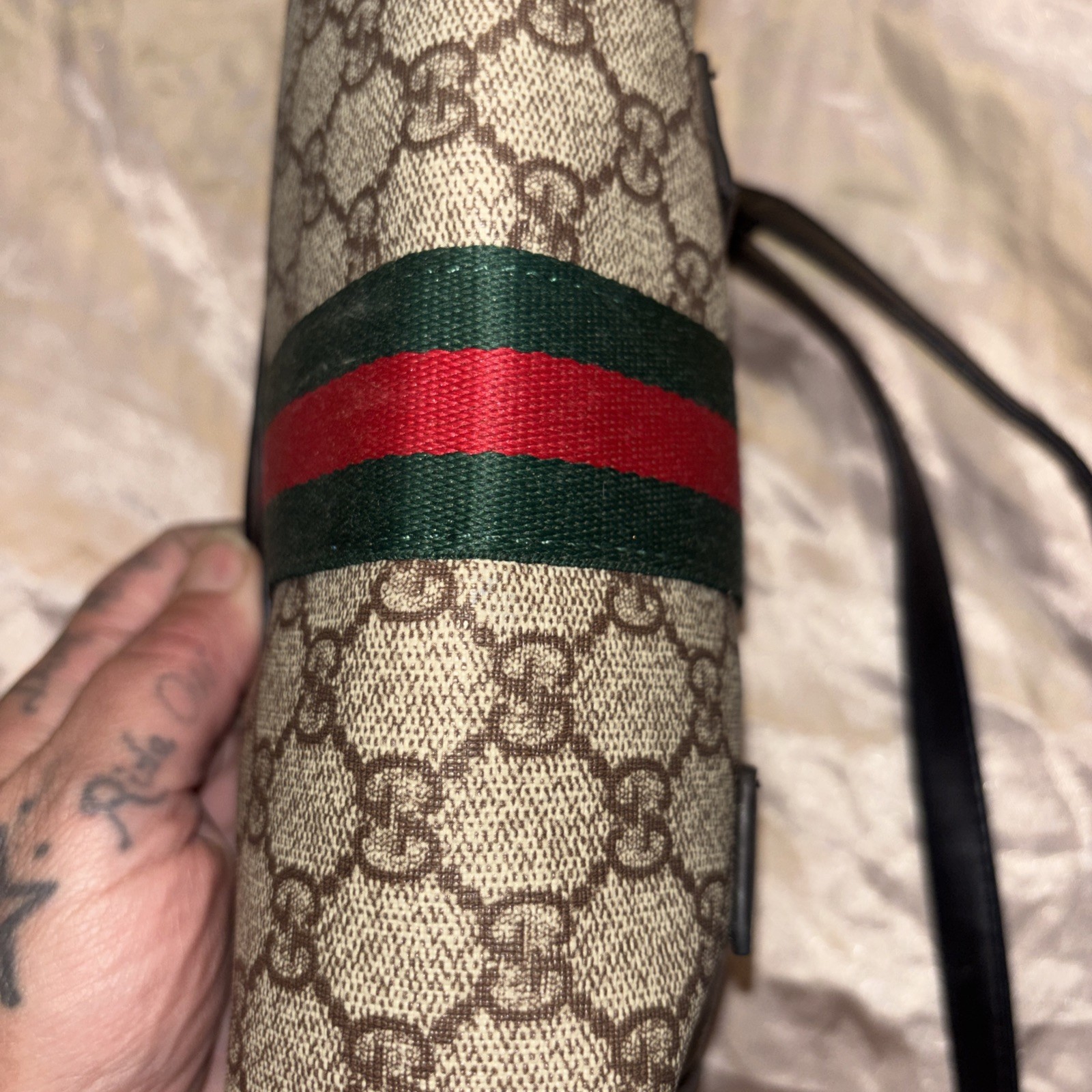 This is a Gucci GG Supreme Ophidia camera-style shoulder bag.