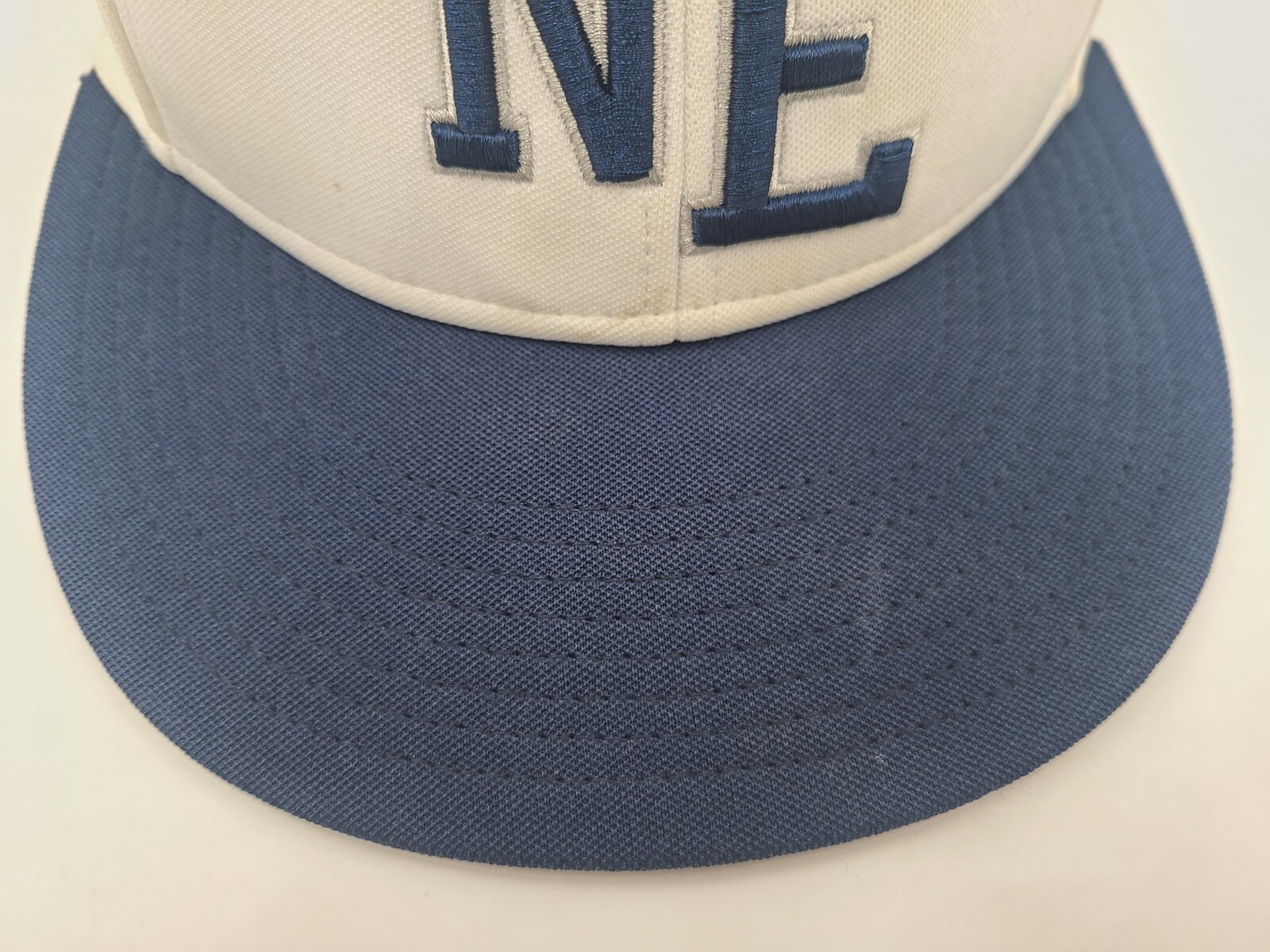 Northeastern High School Eagles The Game Pro Flex Fitted S Hat Cap White Blue