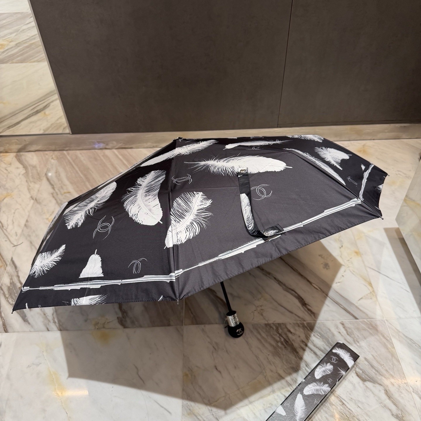 CHANEL Black/White Compact Folding Umbrella Feather Pattern Logo Accent