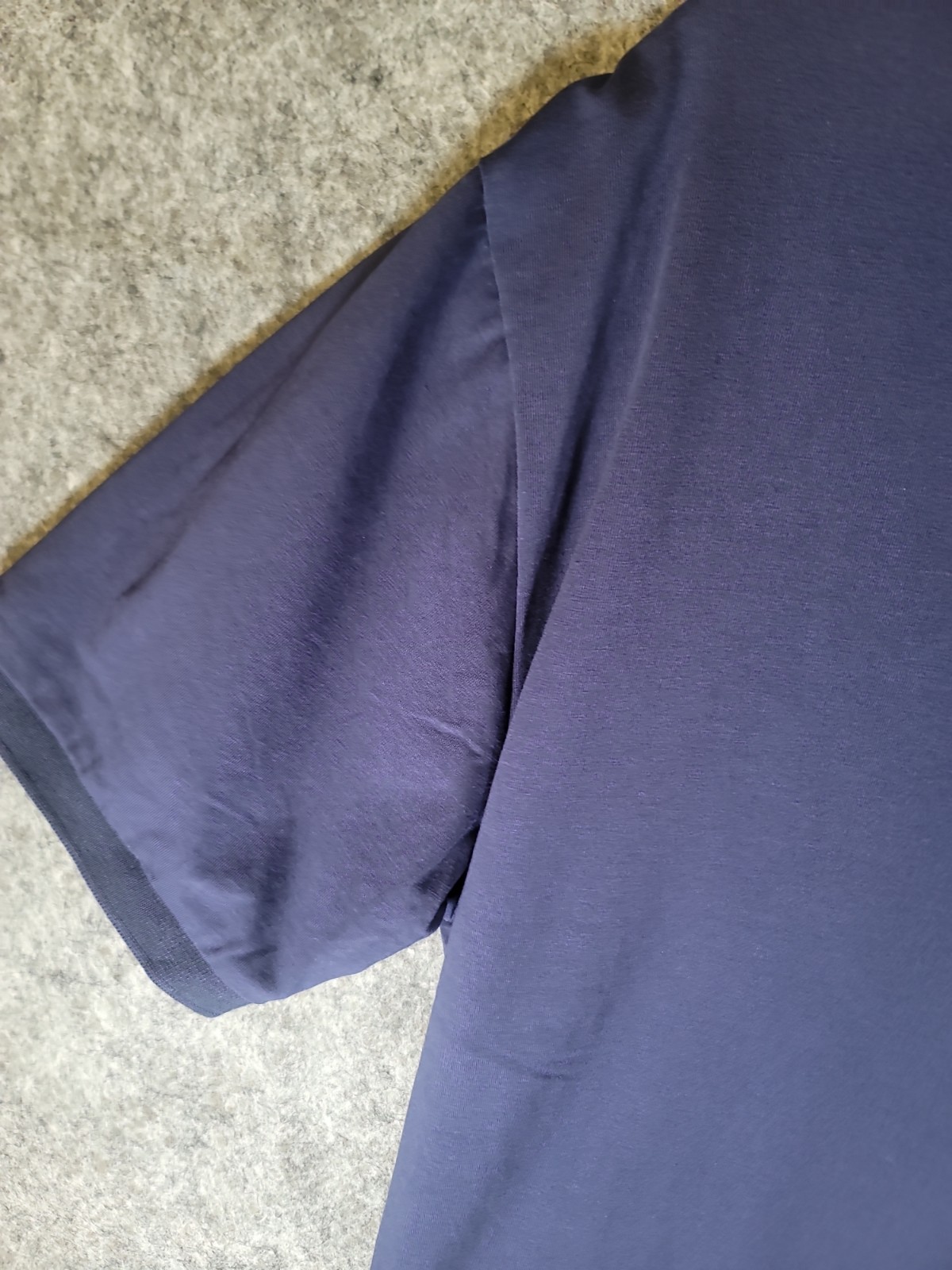 Men’s navy blue Maximos USA Stretch polo shirt features a 3-button placket L