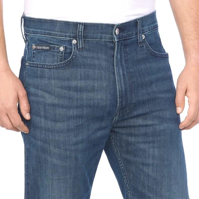Calvin Klein Straight Leg Jeans sits below waist easy fit hip &thigh Medium Wash