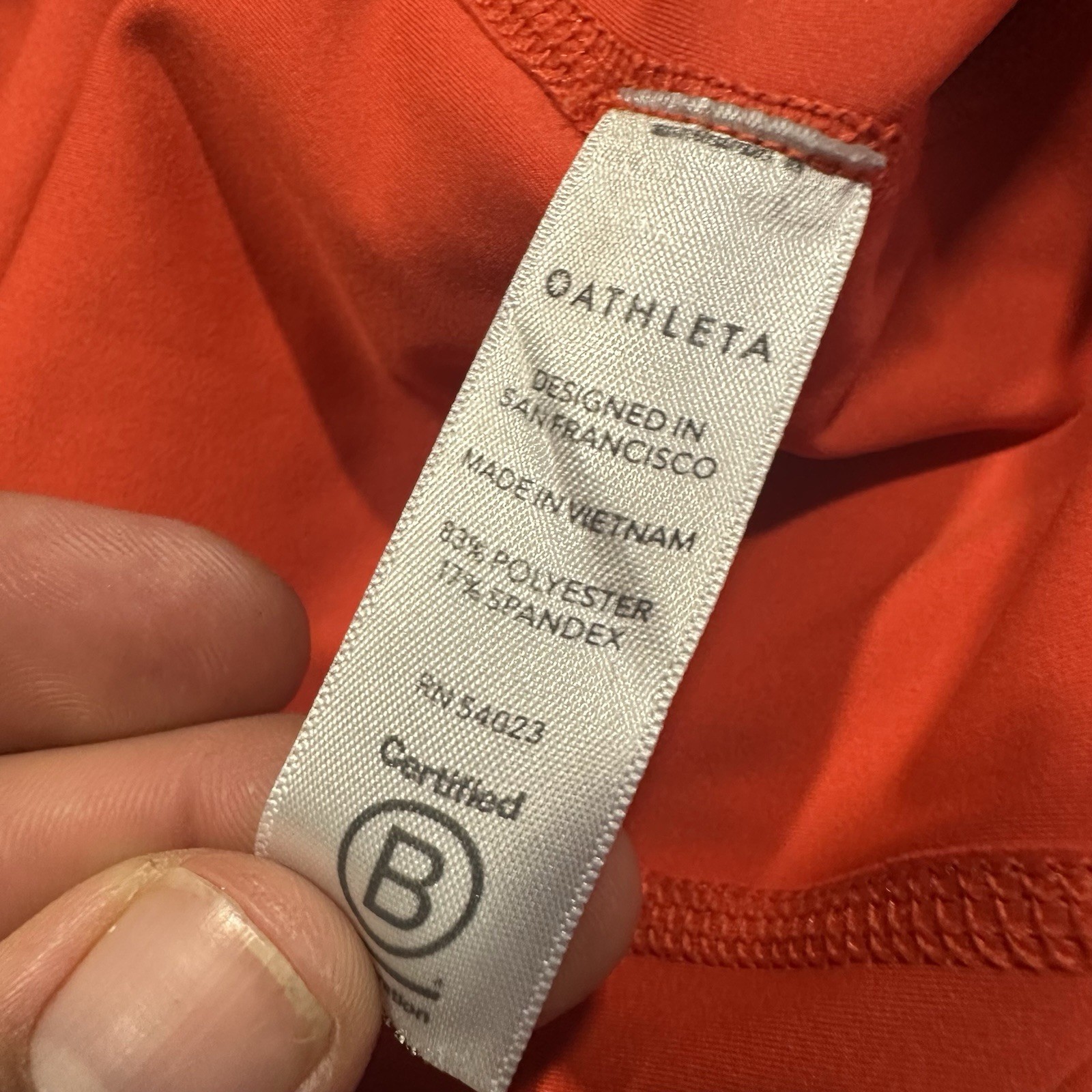 ATHLETA Action Skort in Dobby 14.5 Womens Small Orange Pockets Stretch Athletic