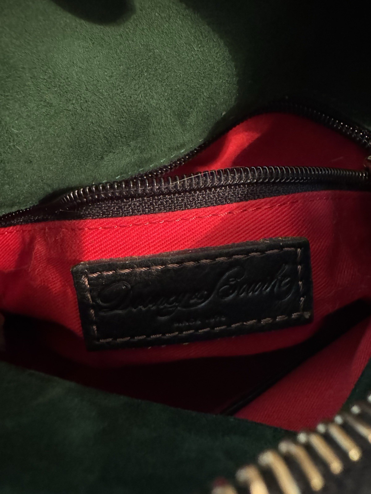 Dooney & Bourke Florentine Black Crossbody Tassel Red Lining adjustable Strap.