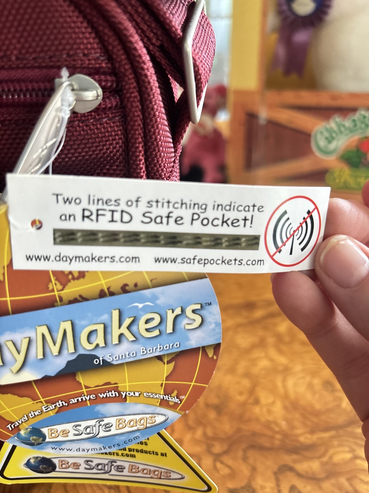 DayMakers Anti-Theft Crossbody Bag in Wine with RFID Security – NEW with tags