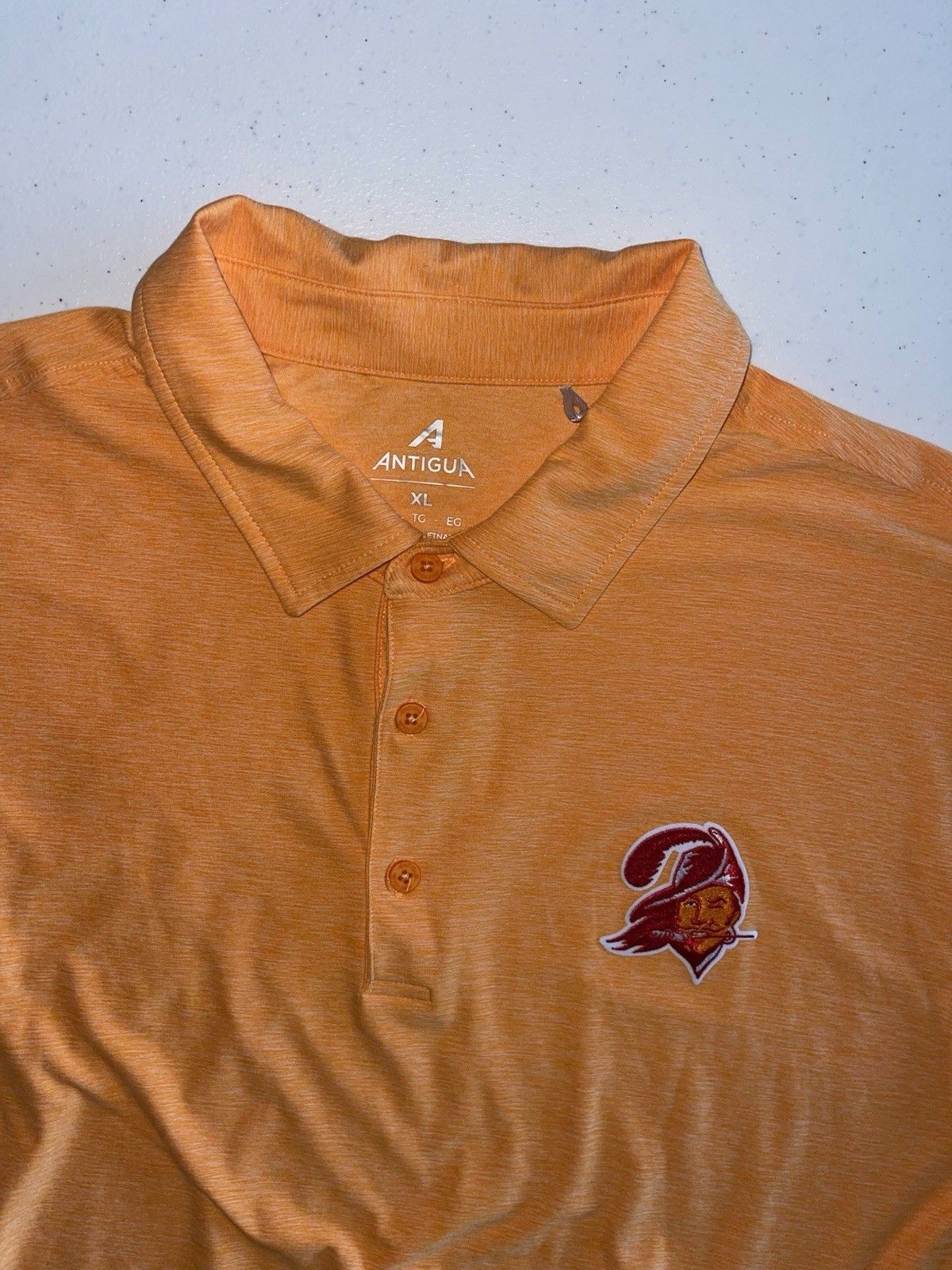 Antigua Men’s Orange Heather Polo with Embroidered Team Crest