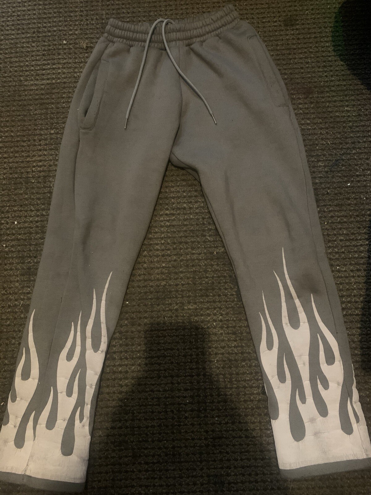 Pants With White Flames At The Bottom And Also There A Medium