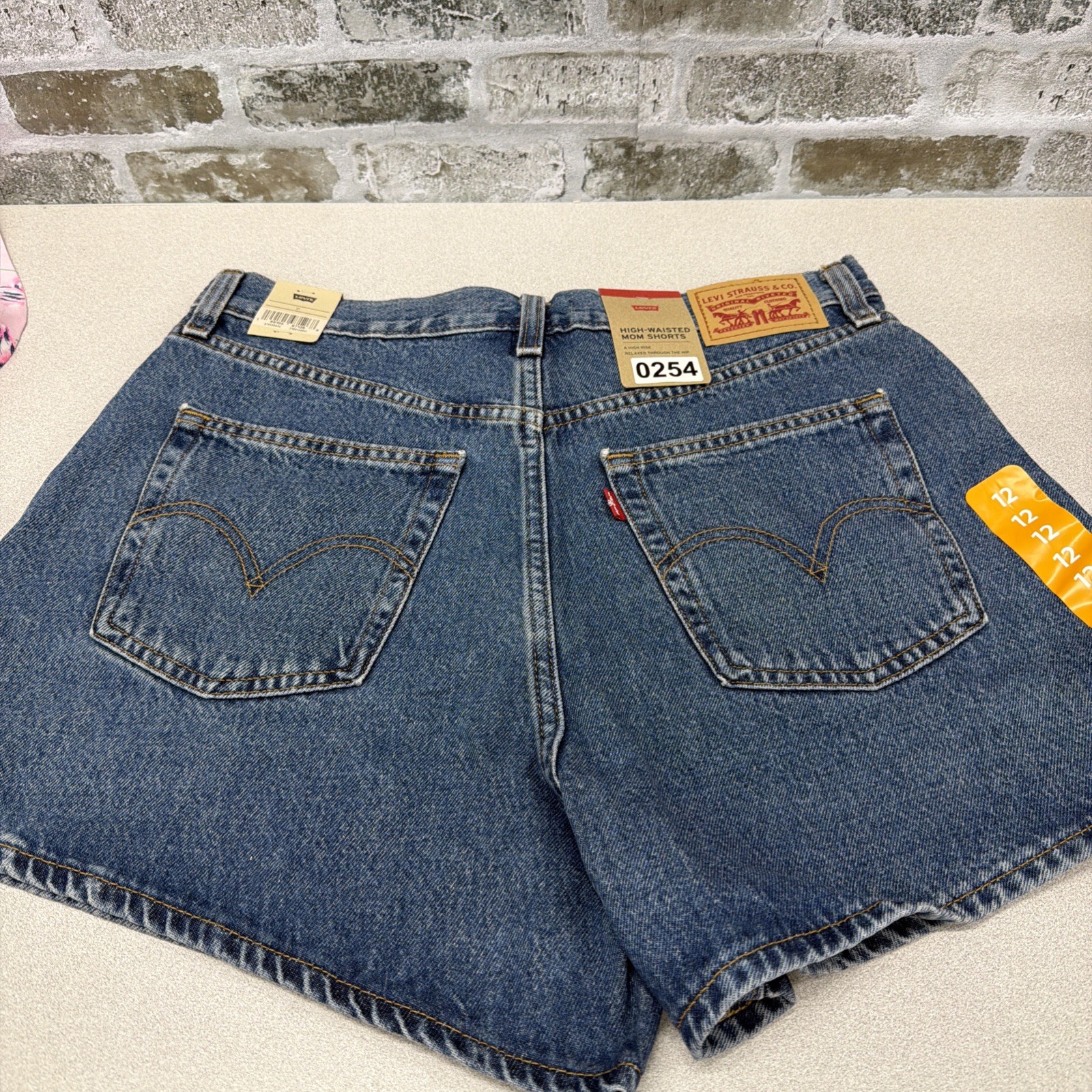 Levi’s Women’s High-Waisted Relaxed Fit 5 Pocket Cotton Denim Mom Short, 31, 12