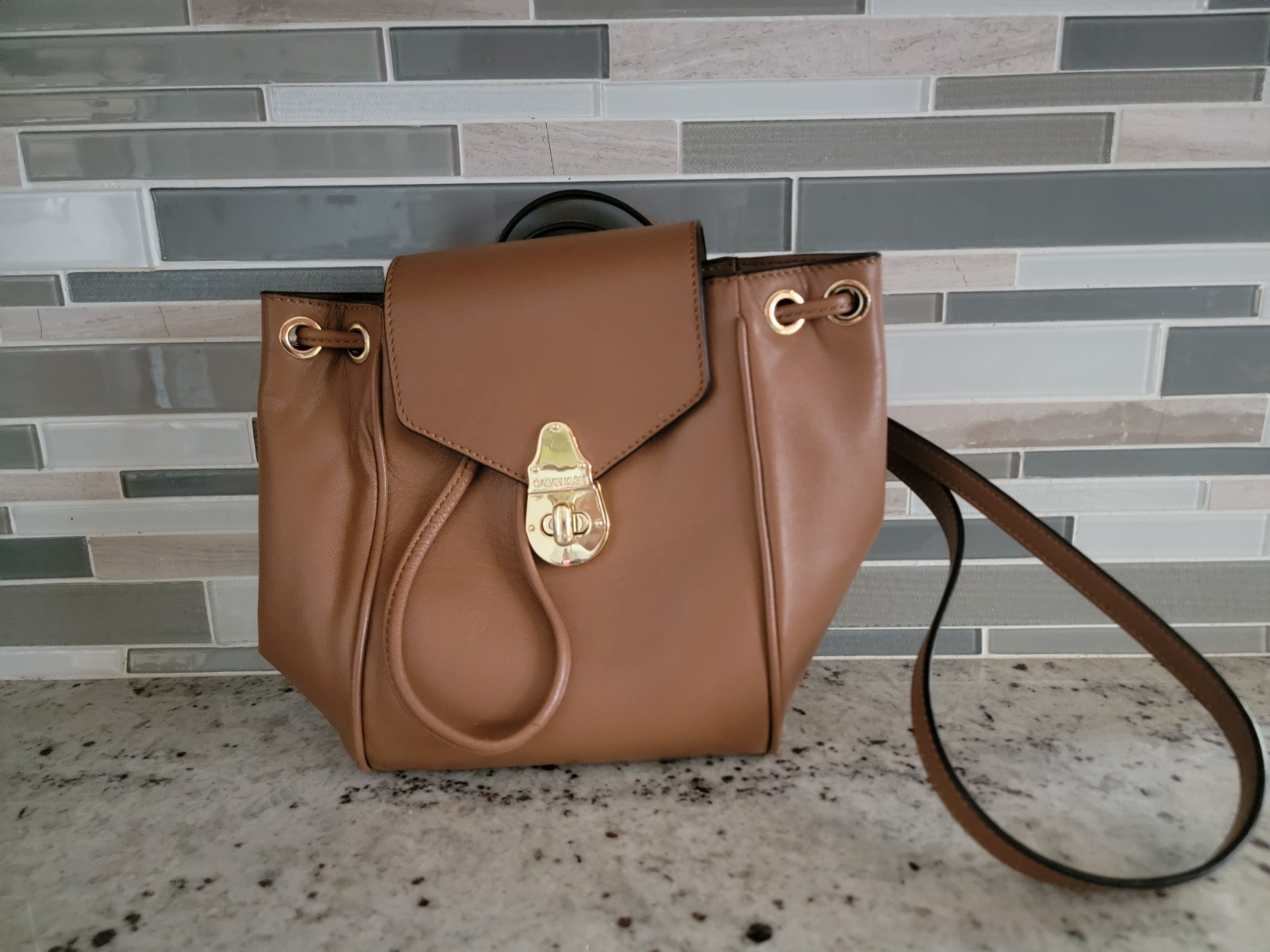 Calvin Klein Crossbody Bucket Bag Brown Leather Gold Logo Engraved Pushlock NWT
