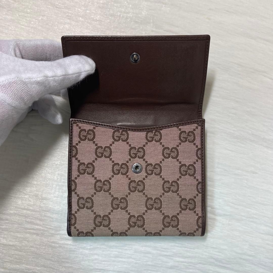 Popular item excellent condition GUCCI two fold canvas flap hook brown