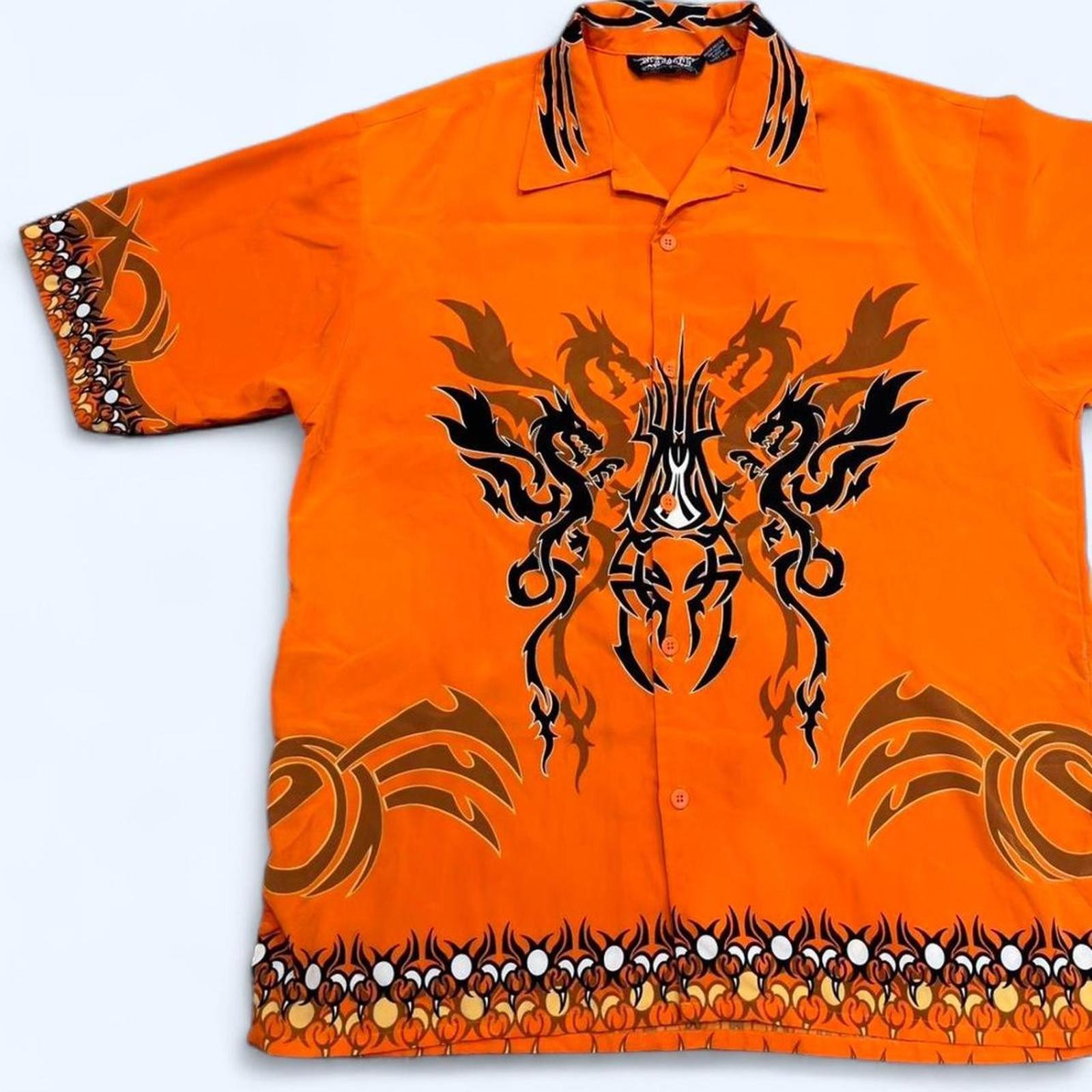 Orange and black dragon button up shirt with a small hole can be sewed size xl