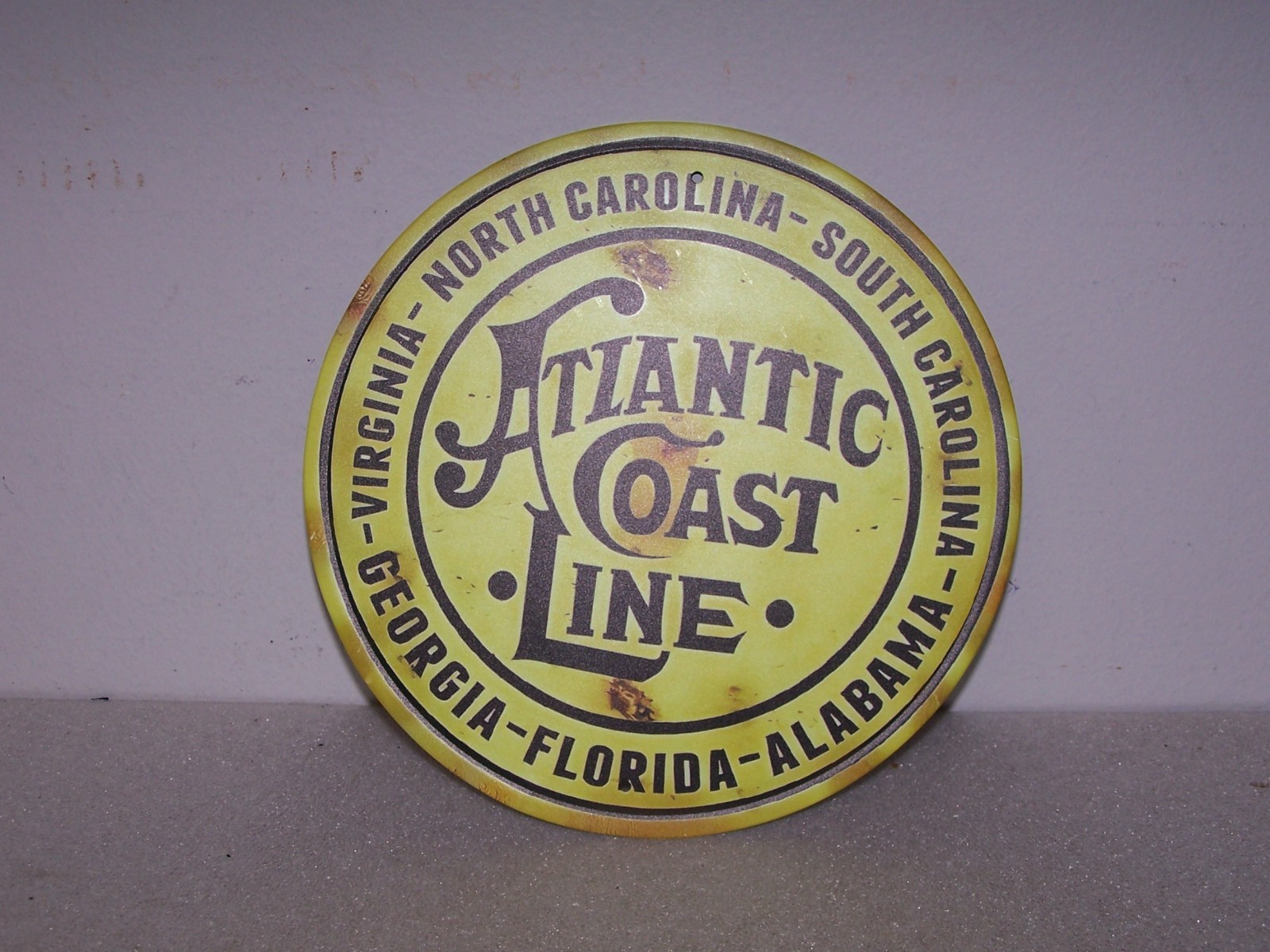 7.75″ tin placard, Atlantic Coast Line RR, yellow weathered background
