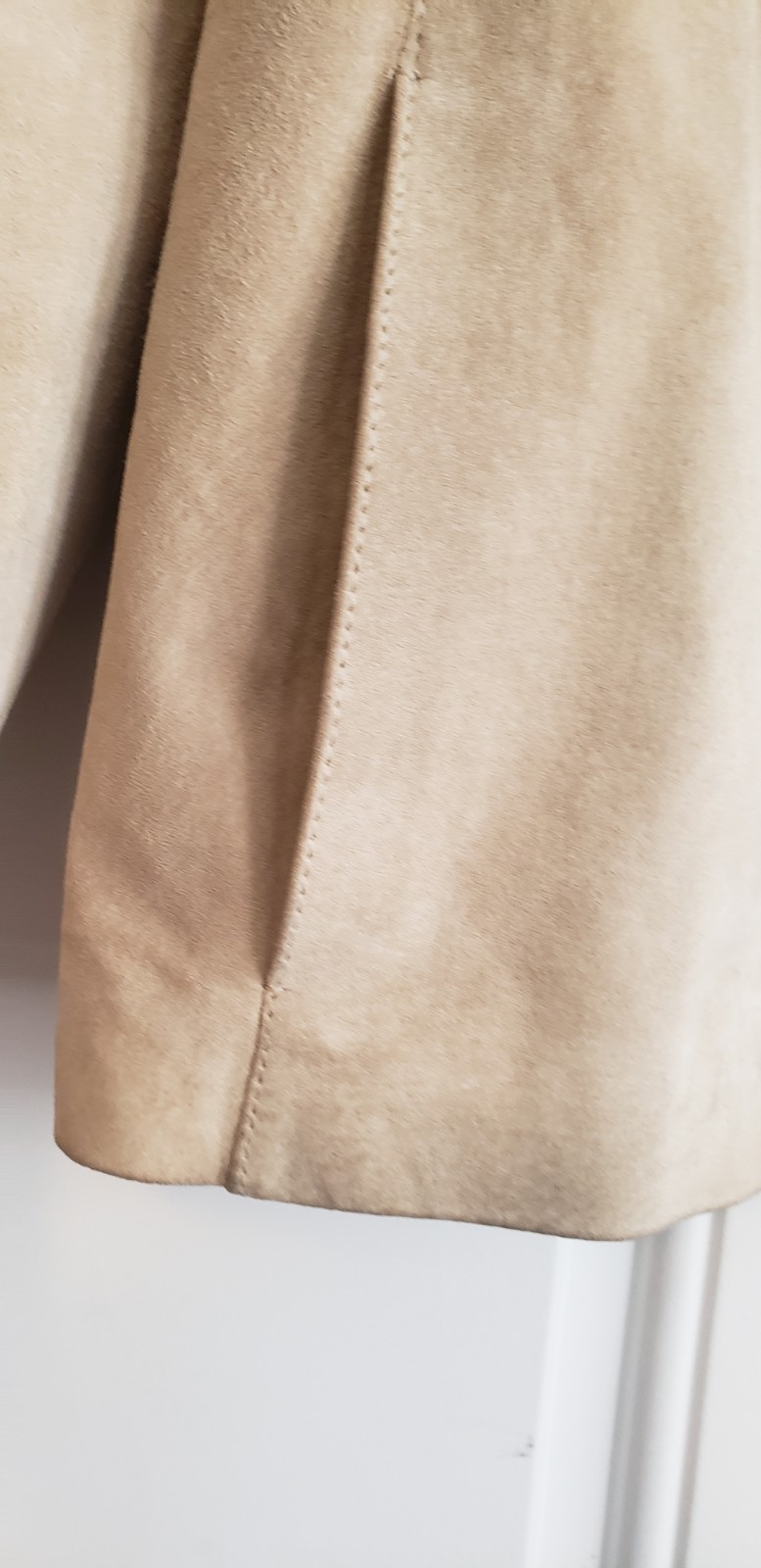Merona beige collarless suede jacket. It features a minimalist, open-front…