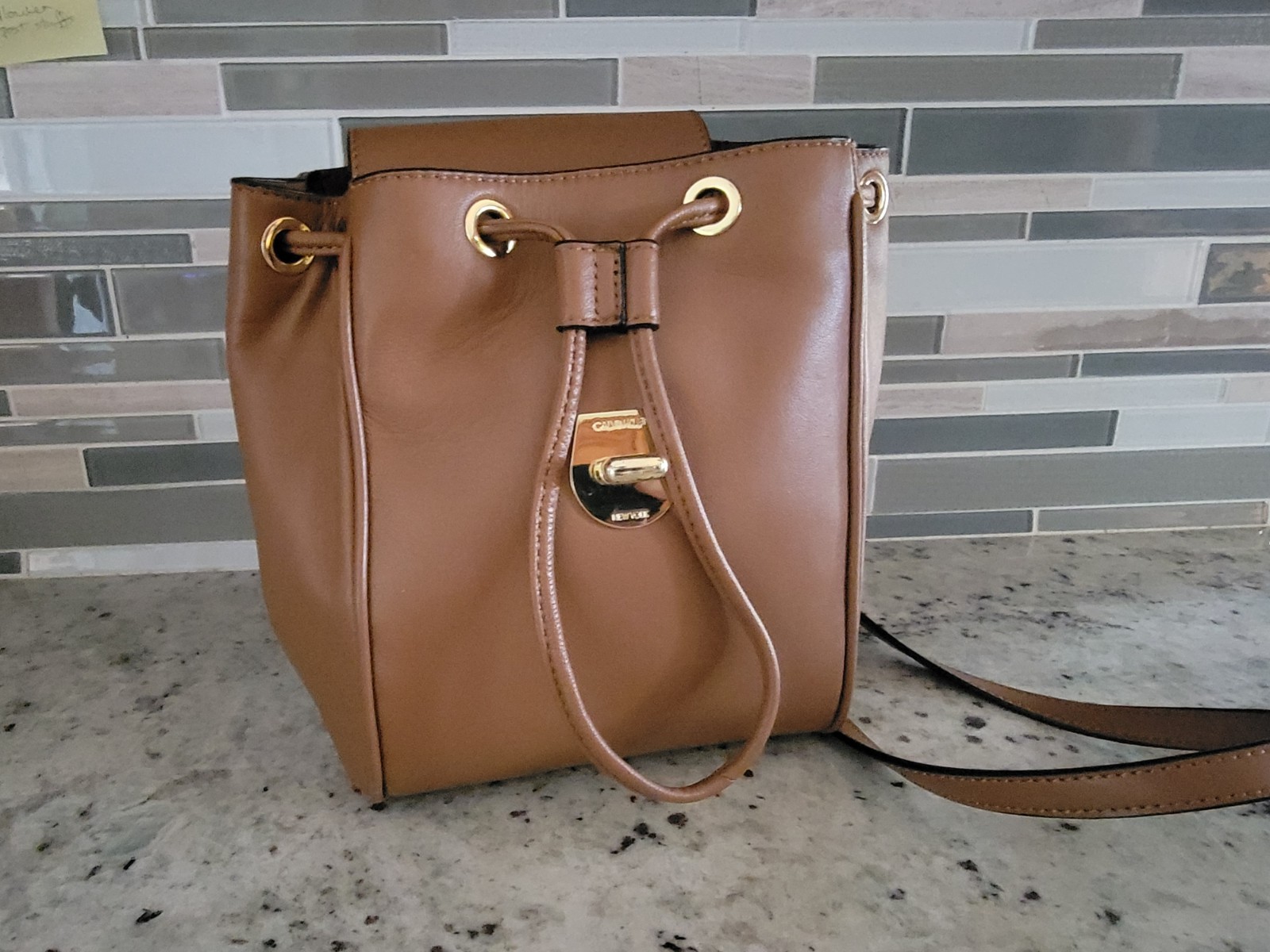 Calvin Klein Crossbody Bucket Bag Brown Leather Gold Logo Engraved Pushlock NWT
