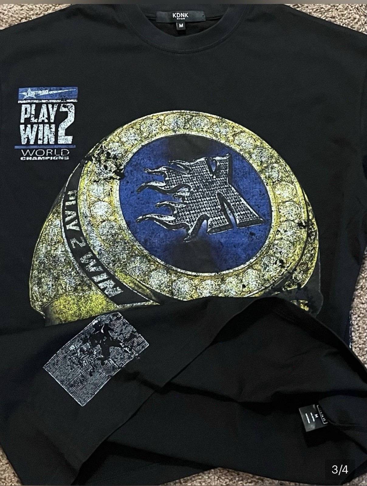 KDNK Black Graphic Tee with Bold Yellow & Blue Ring Design