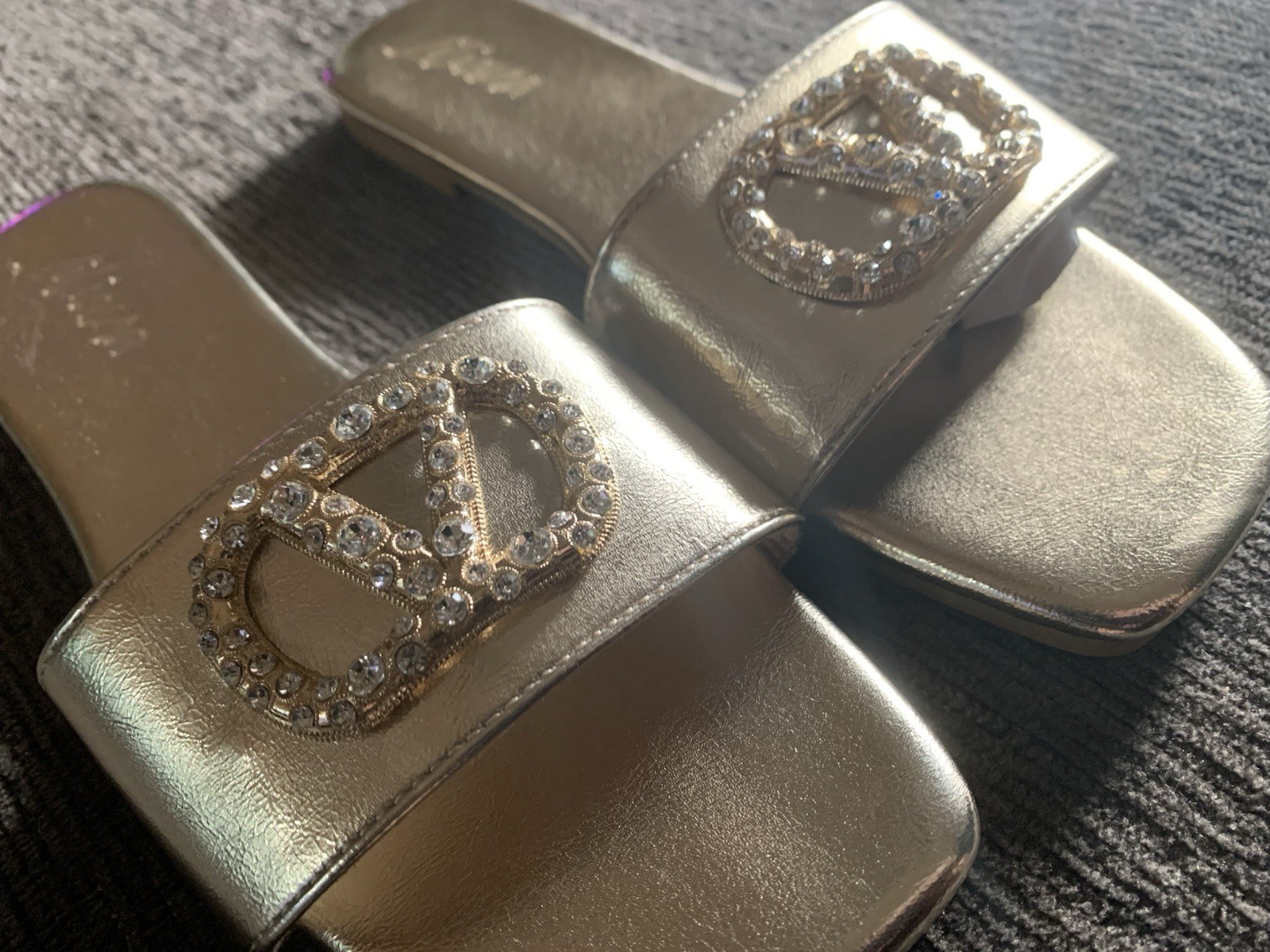 Liliana Rhinestone logo slide in gold.