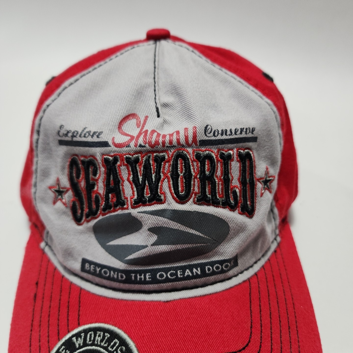 Sea World Shamu Explore Conserve Beyond The Ocean Floor Red Grey Strapback Hat