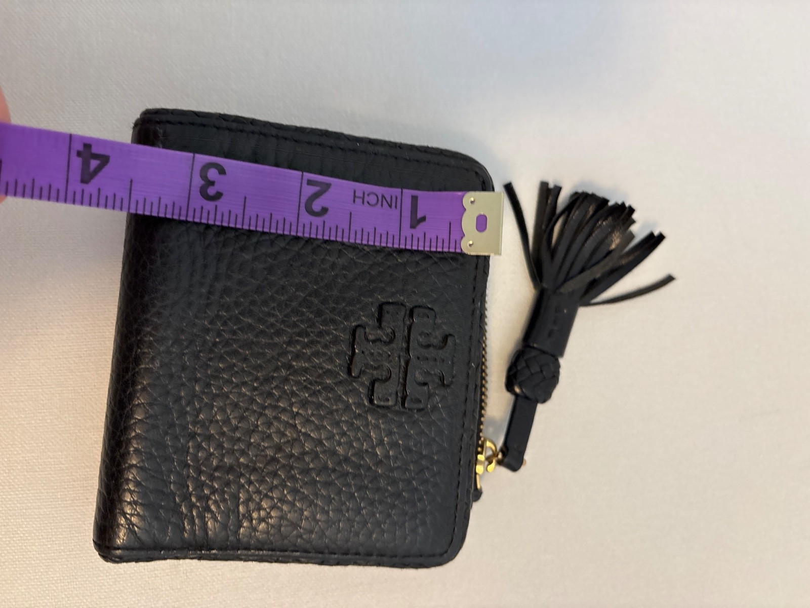 Tory Burch Thea Black Pebbled Leather Bifold Zip Wallet Tassel Gold Tone Logo