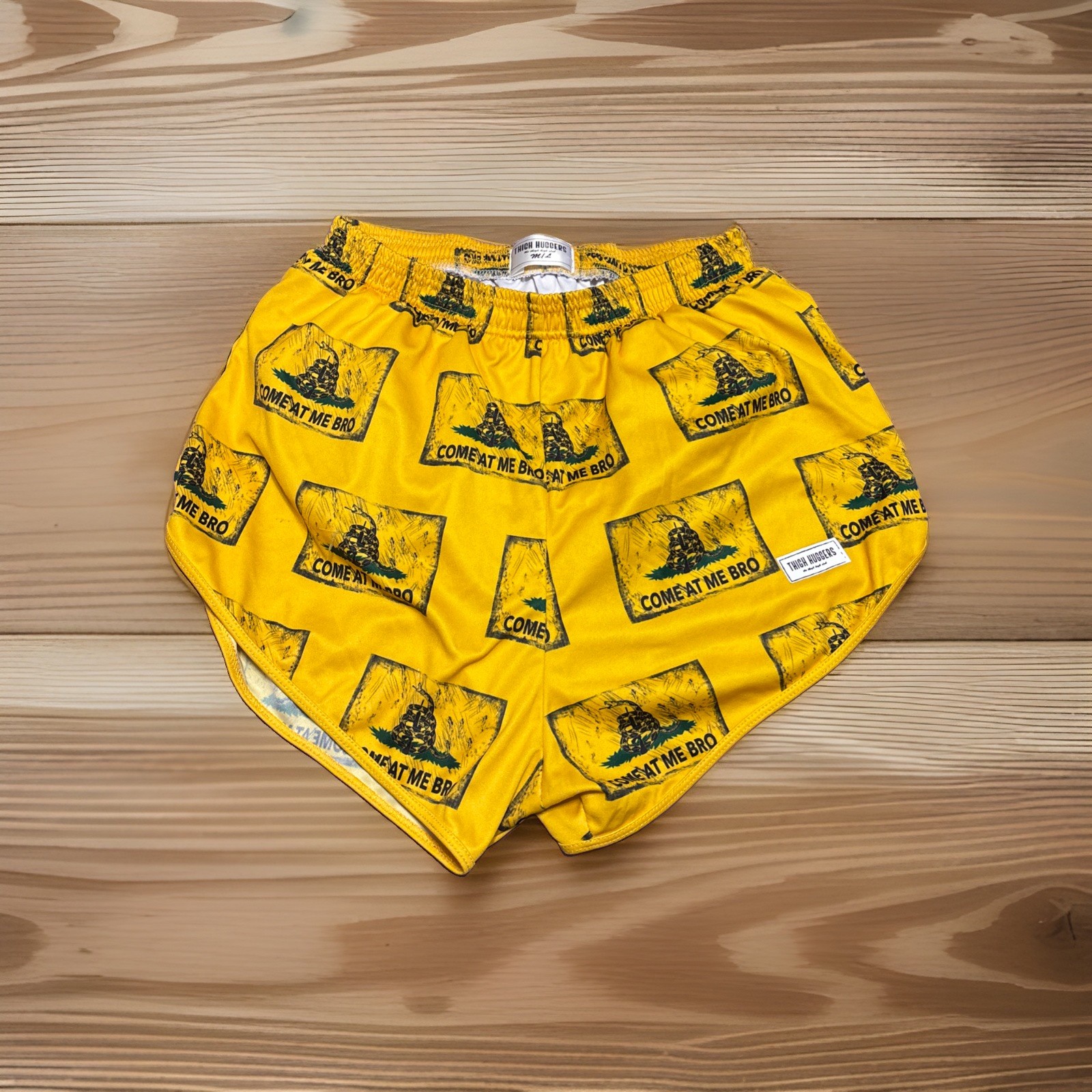 Mens-SZ Medium Thigh Huggers shorts feature a repeating “Come At Me Bro”- Yellow