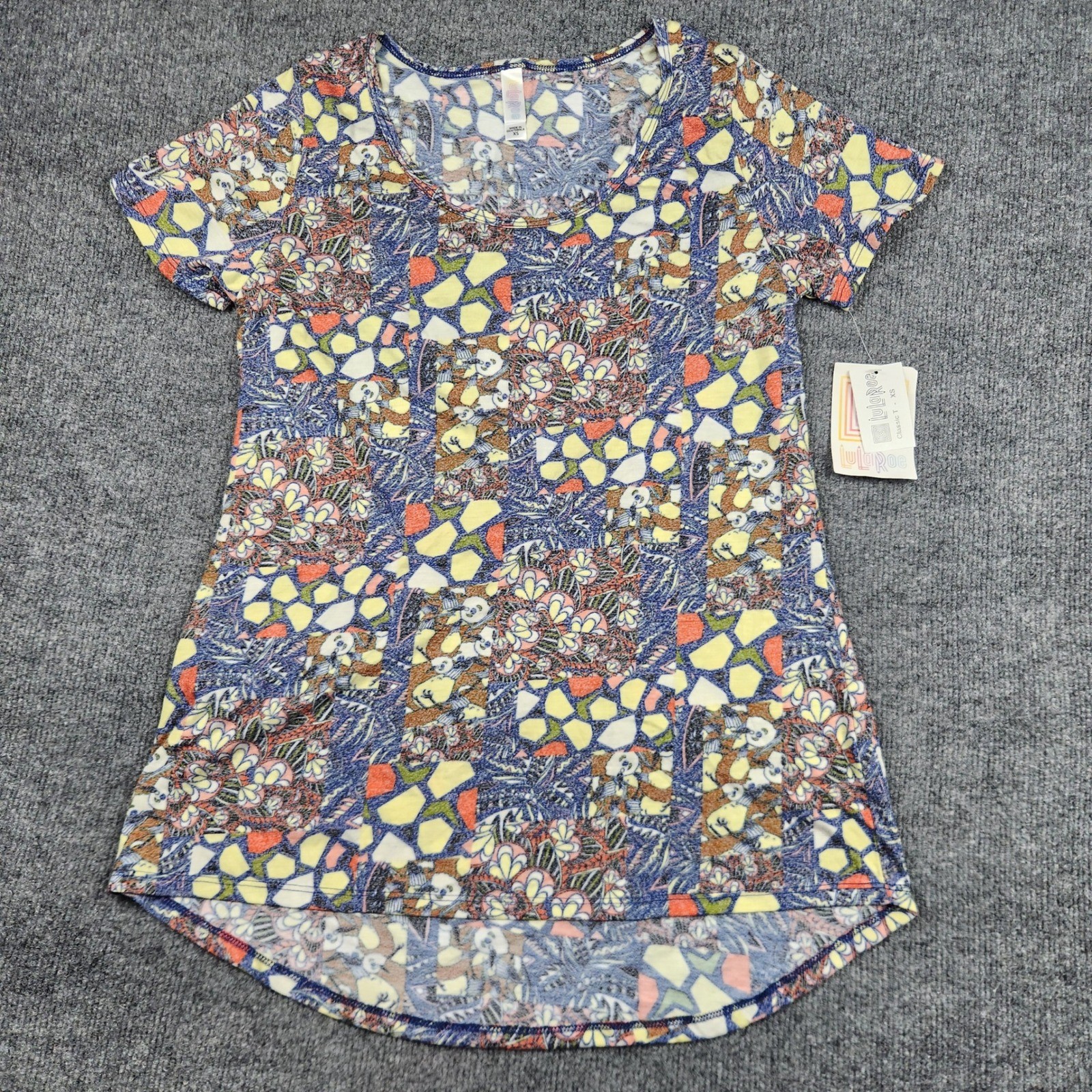 LuLaRoe Classic T Womens XS Blue Yellow Floral Geometric Patchwork High Low Top