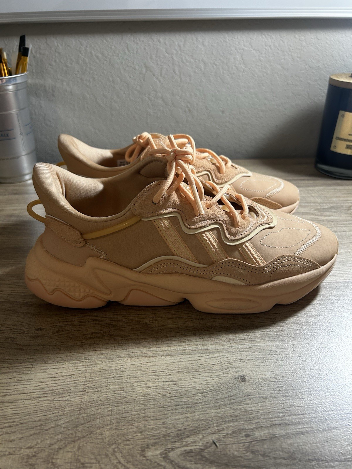 Adidas Originals Ozweego in the “Glow Orange” or “Pale Nude”