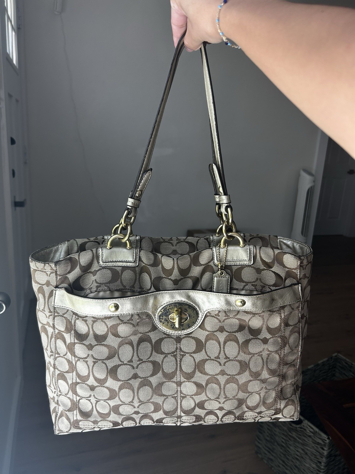 Coach Signature Canvas Tote Bag with turn-lock front and gold hardware