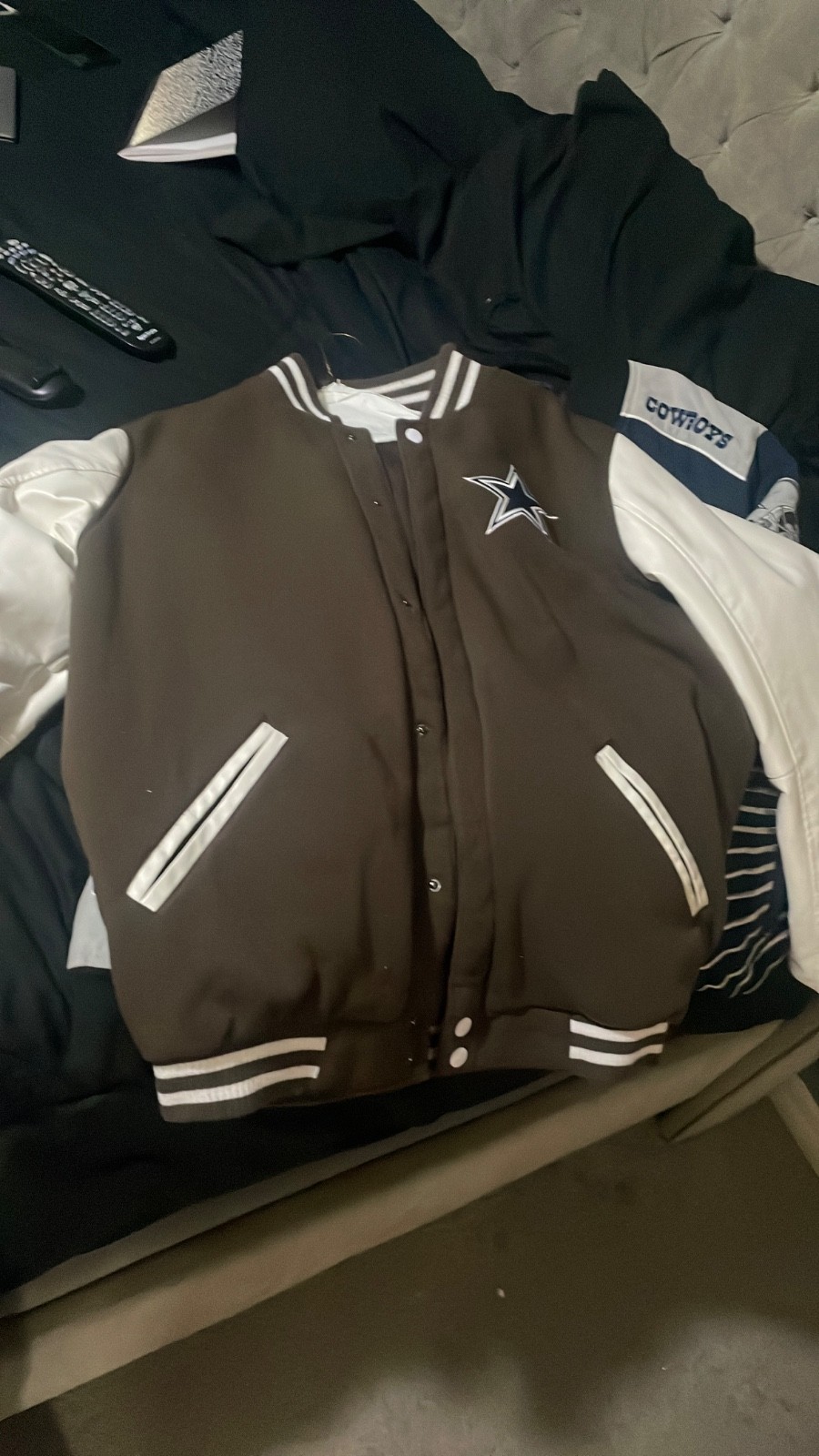 brown and tan reversable cowboys jacket