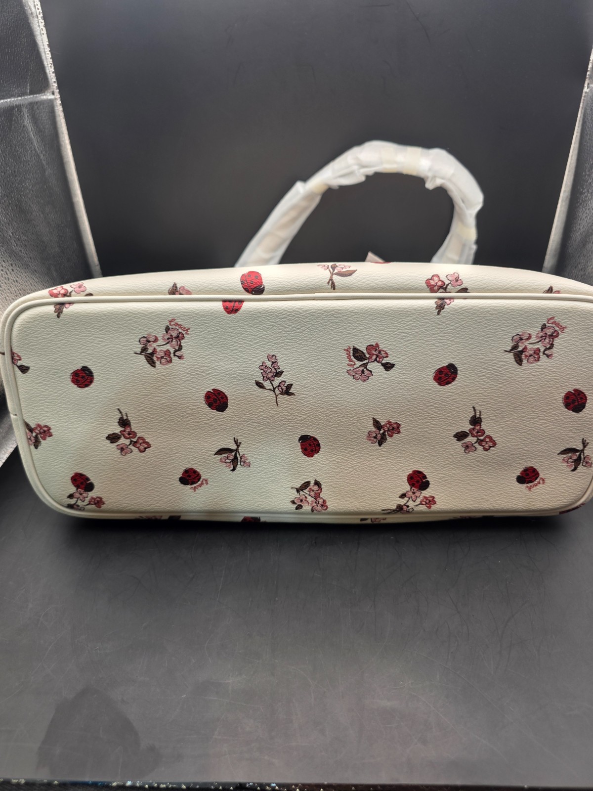 NEW COACH GALLERY TOTE WITH LADYBUG FLORAL PRINT (SCUFF MARKS BACK)