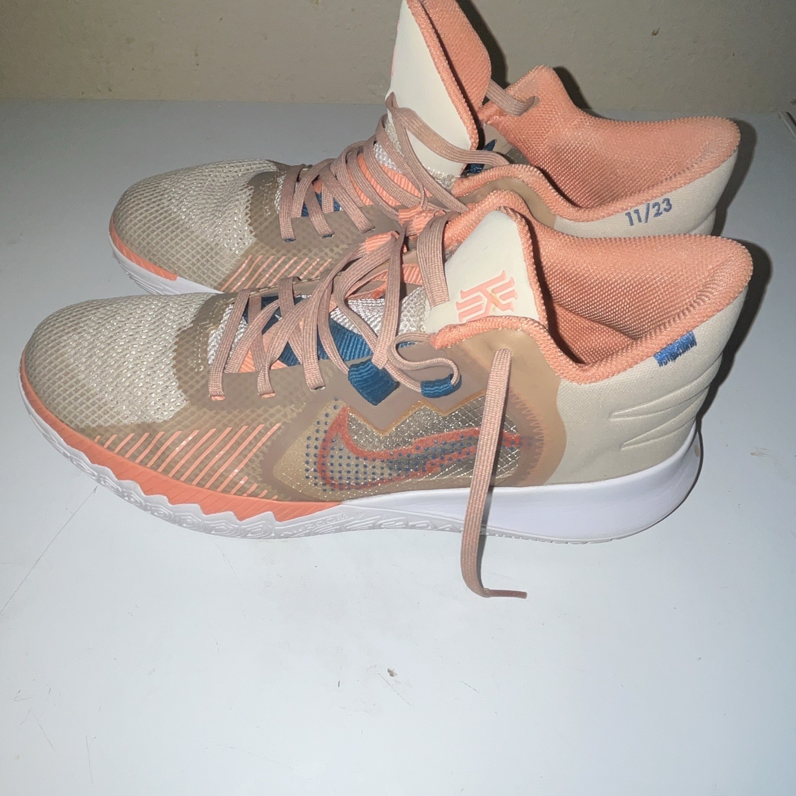 Nike Kyrie Men’s Mid Top Basketball Lace-Up Sneakers Beige Orange Blue