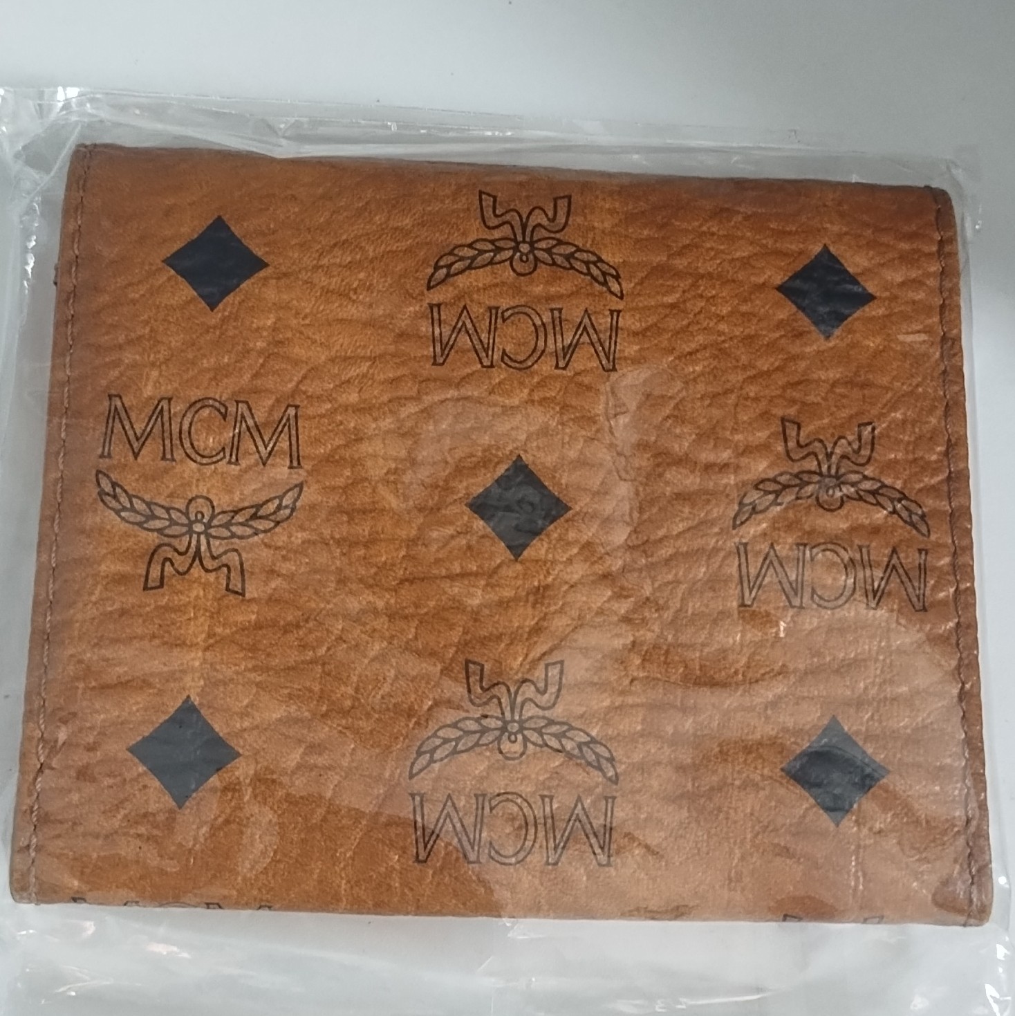 MCM Brown Logo Print Folding Wallet for Unisex with MCM Character Logo Theme