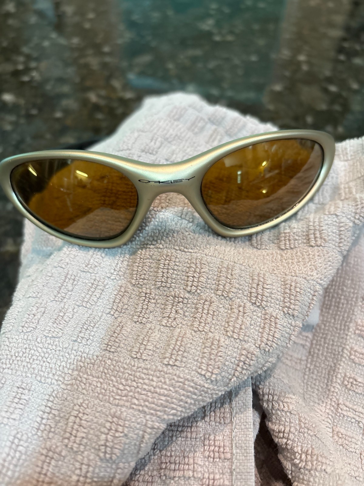 Oakley Minute 1.0 Sunglasses; Gold Frame with Amber Lenses